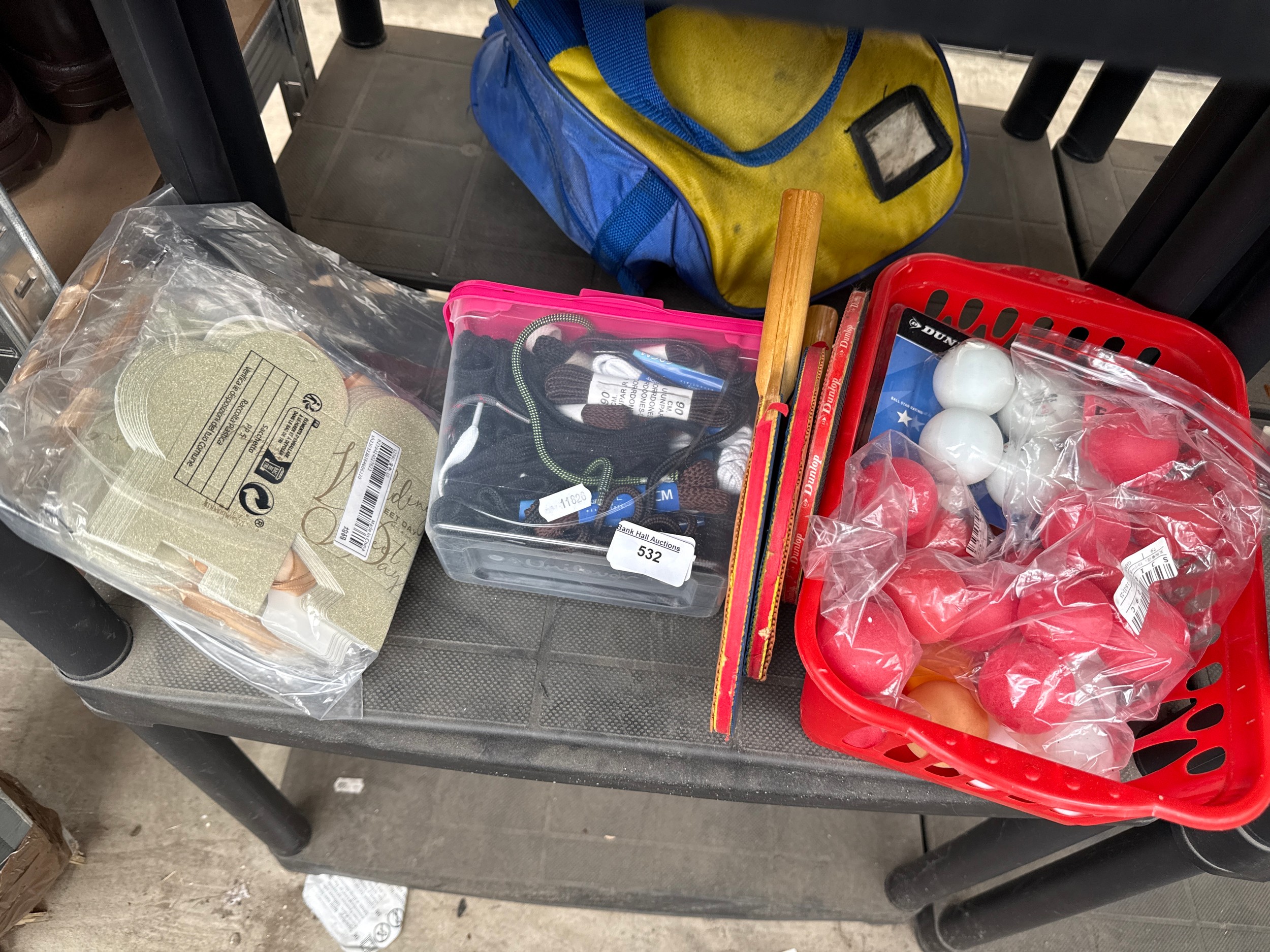 Lot inc table tennis balls and bats, shoe laces, gift tags