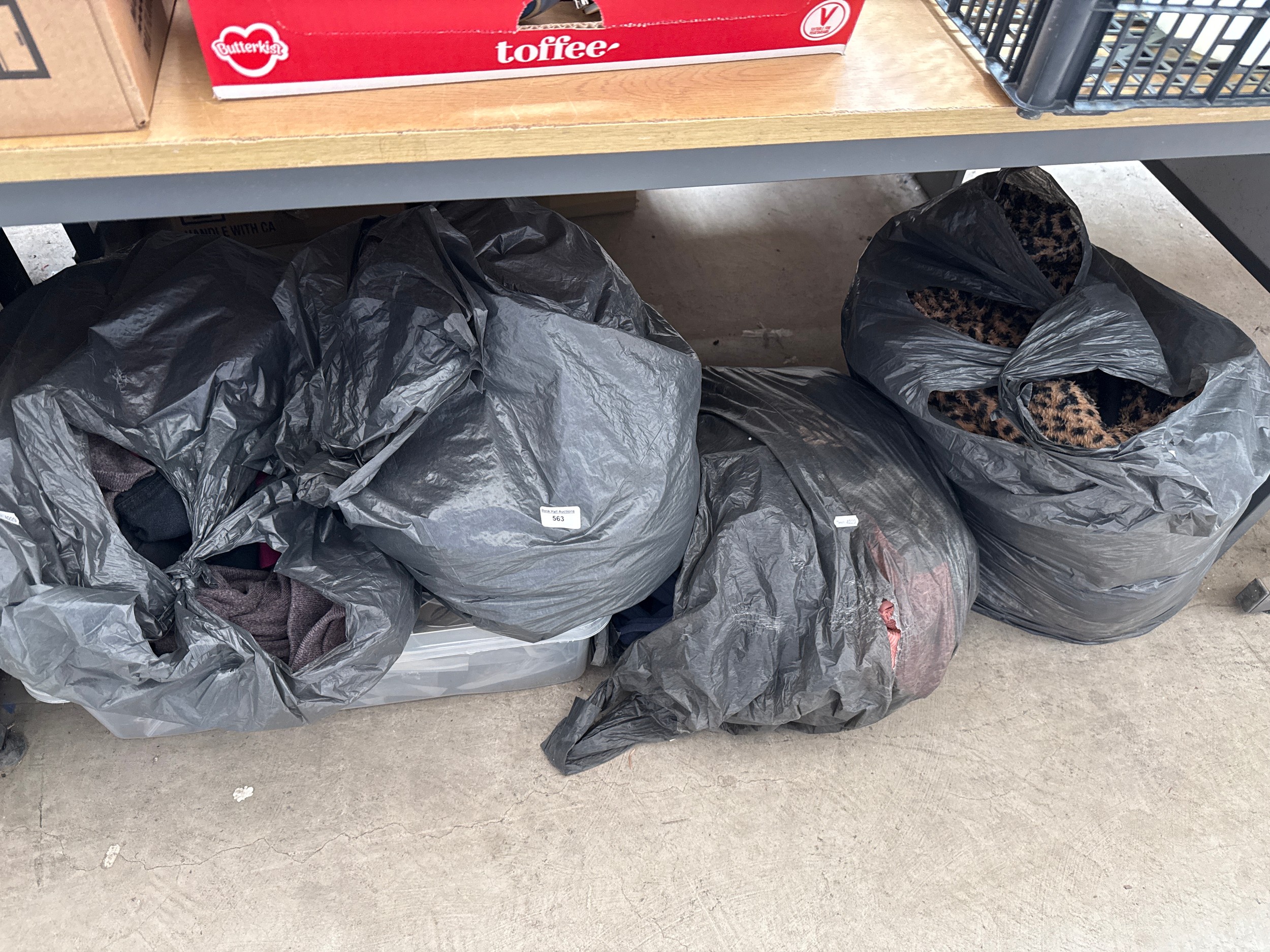 Four bags and box of clothing