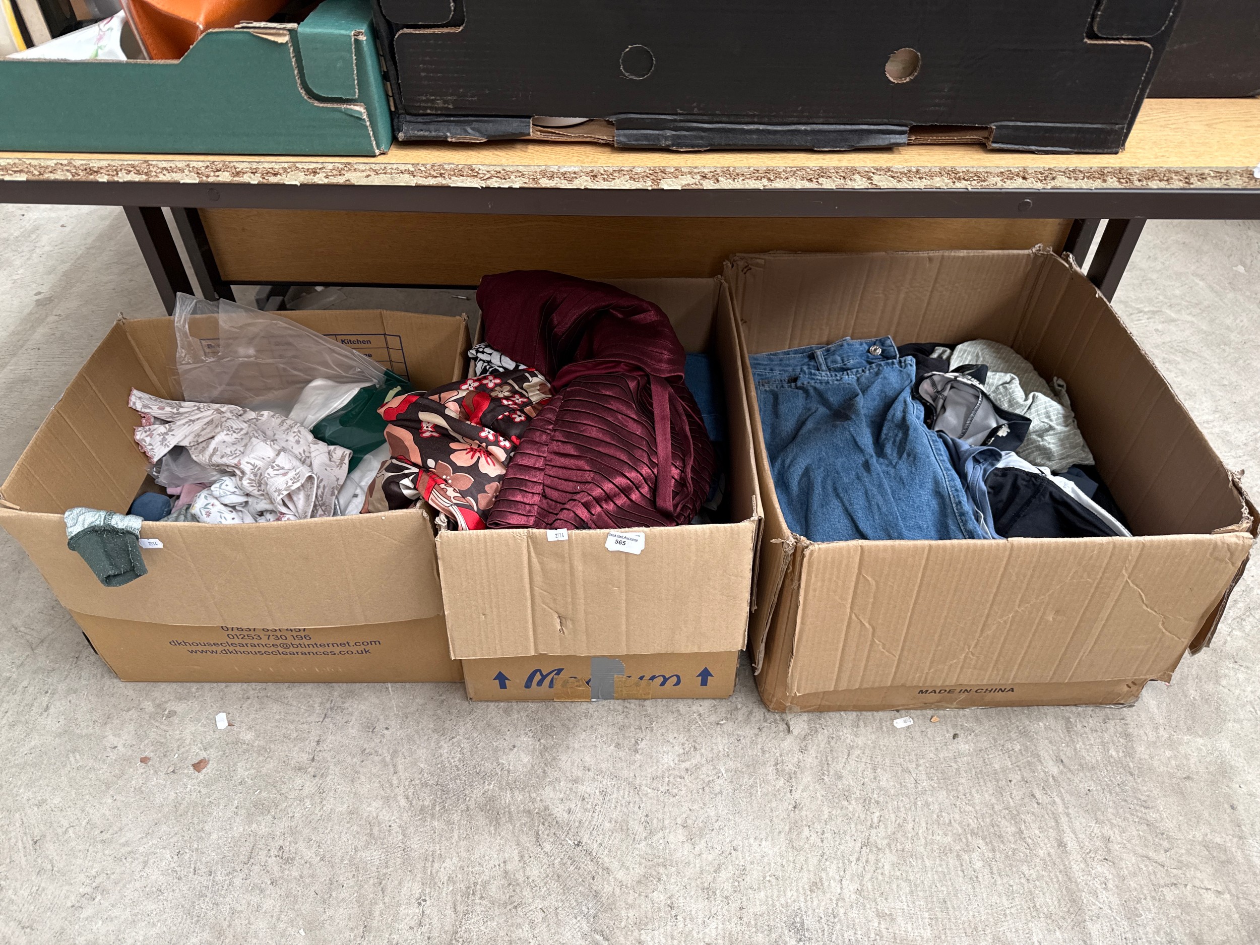 Three boxes of clothing