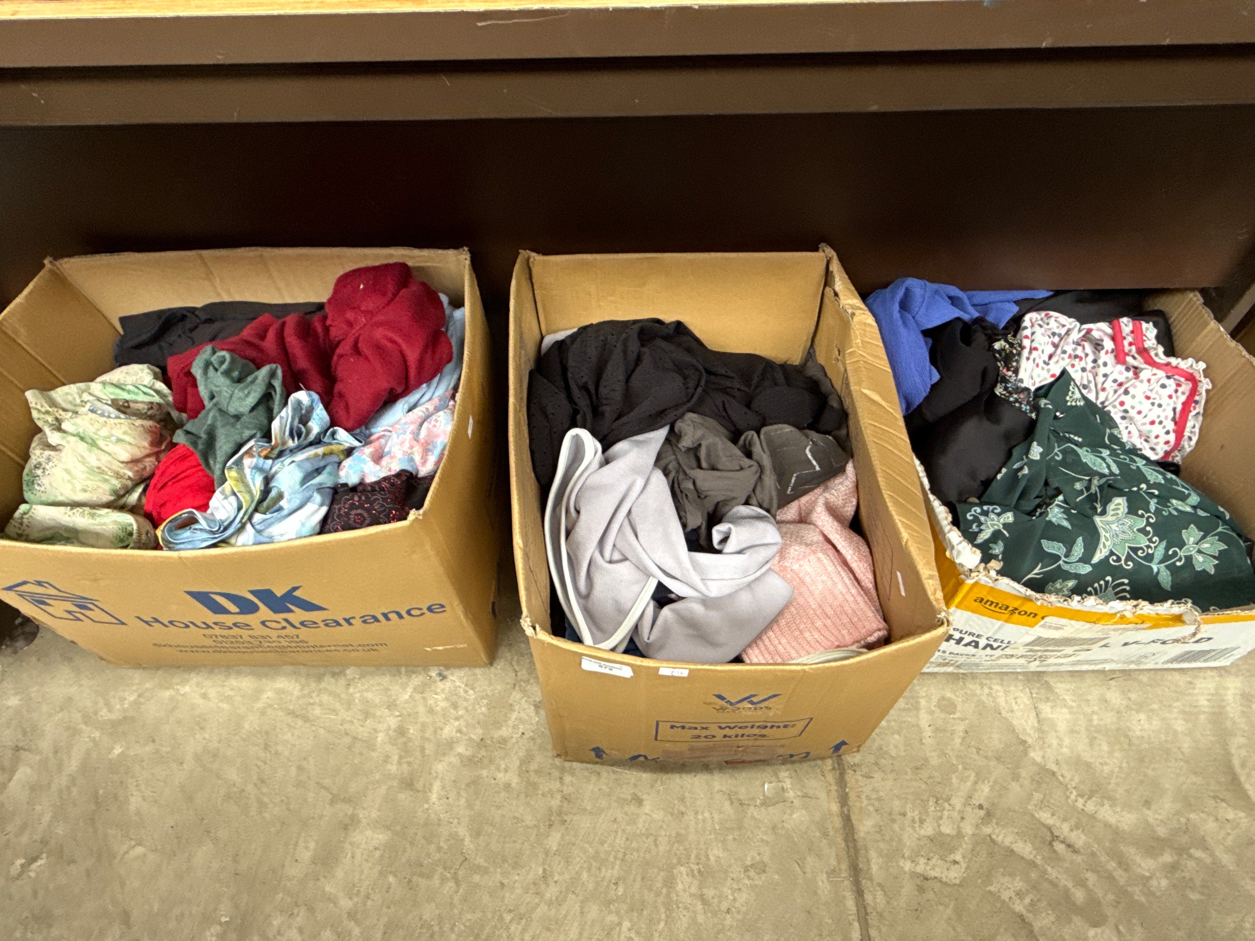 Three boxes of clothing