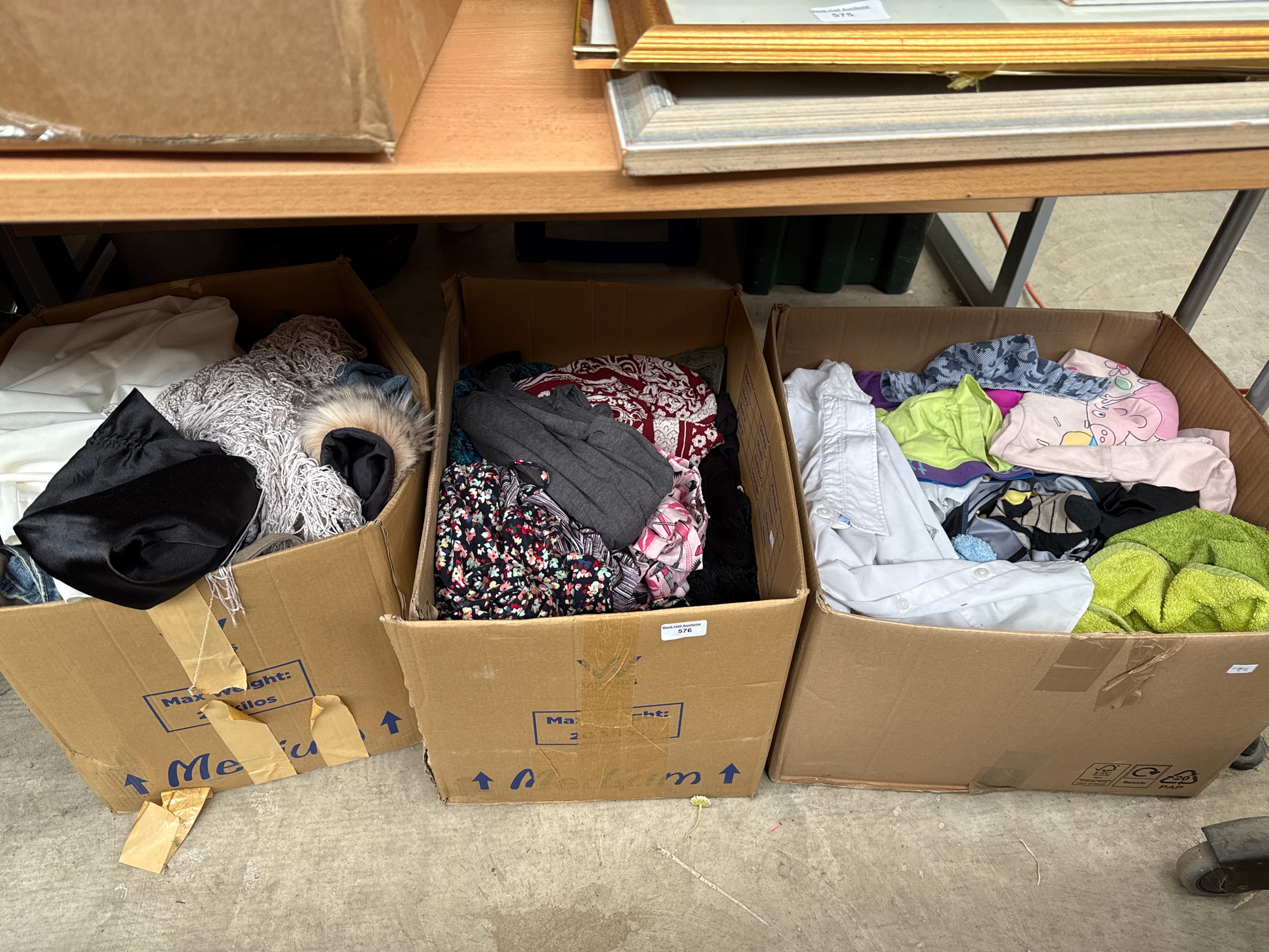 Three boxes of clothing