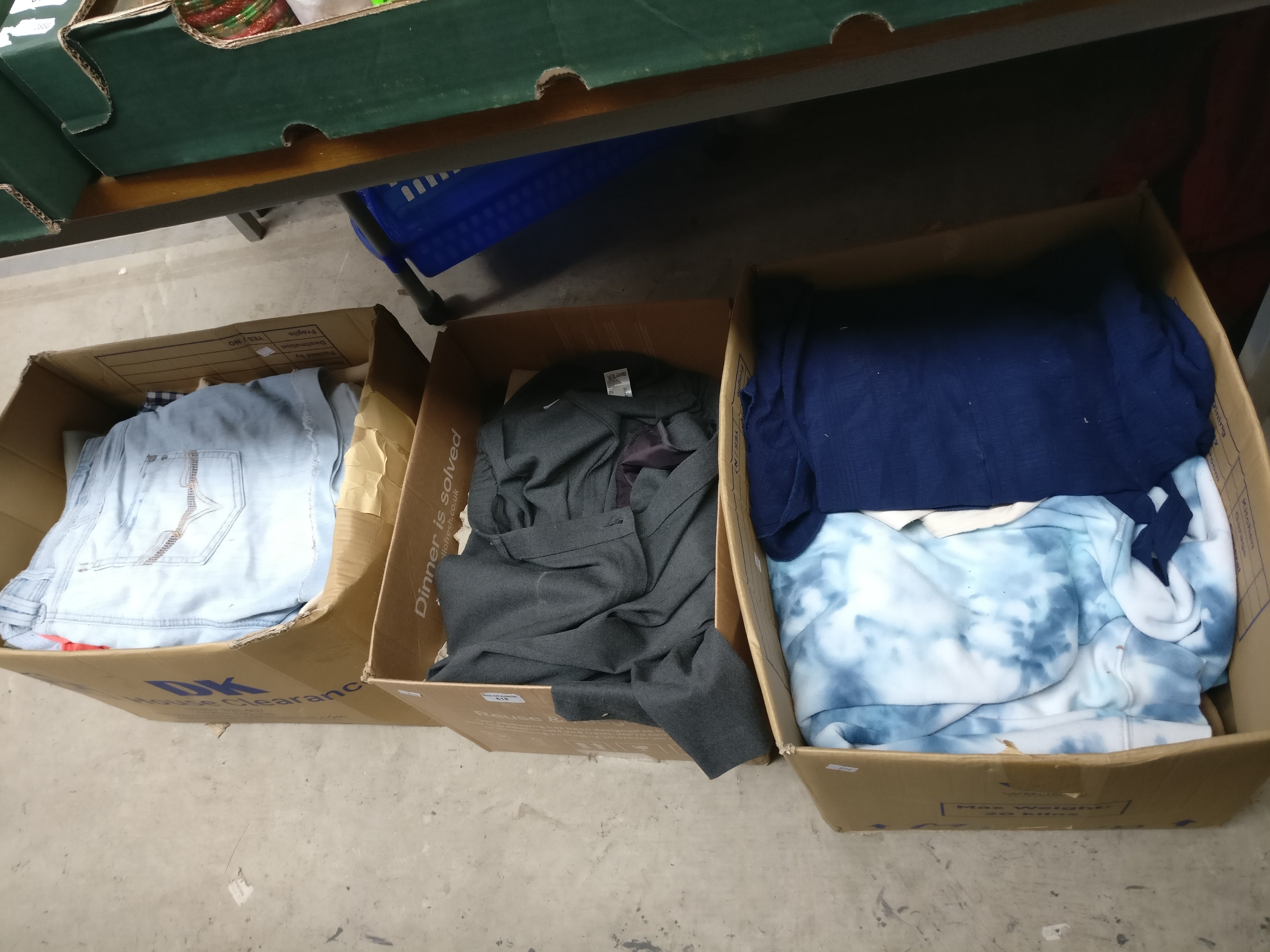Three boxes of clothing