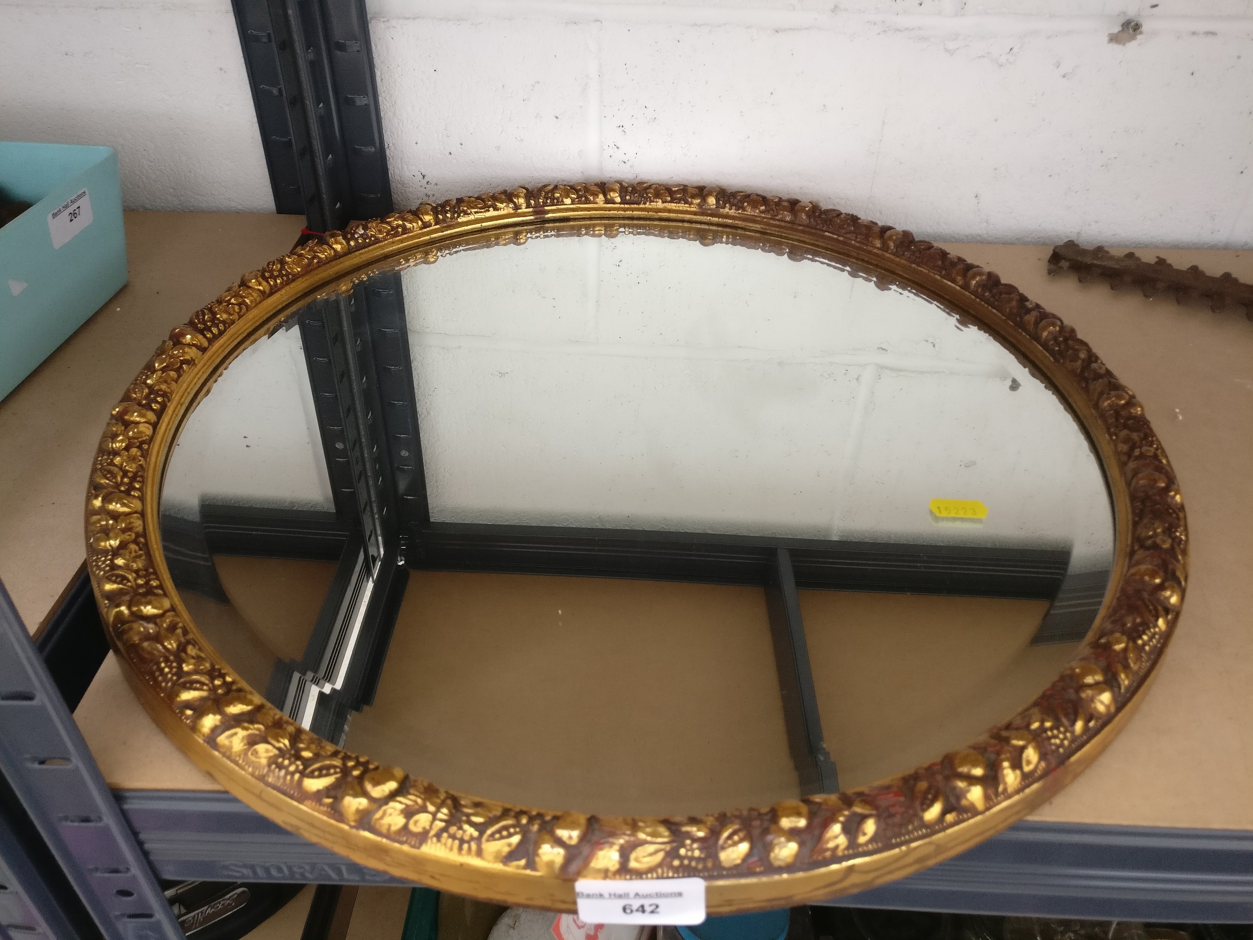 Decorative gilt framed circular bevel edged mirror
