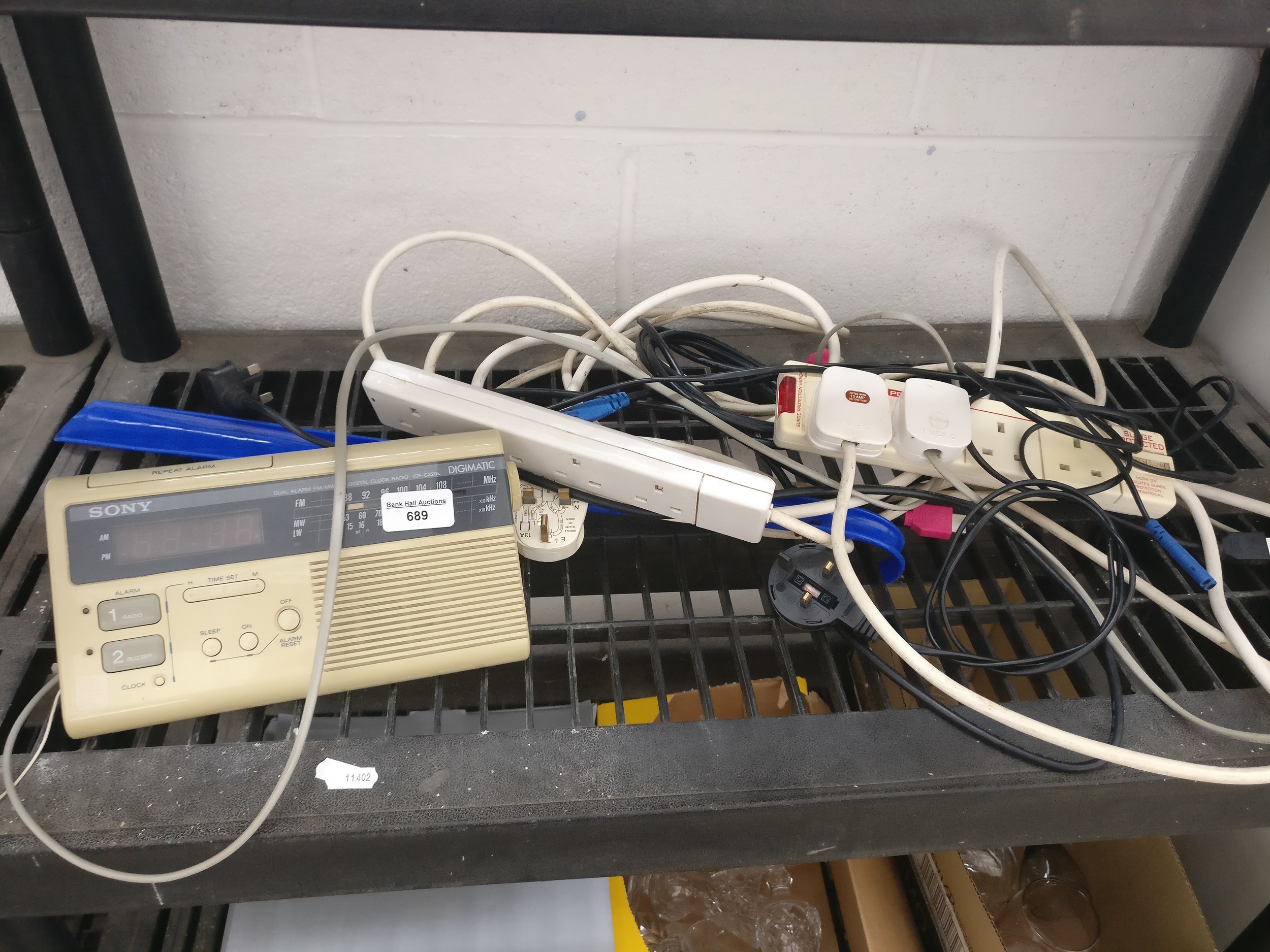 Lot inc Sony radio alarm clock, extension sockets and shoe horn