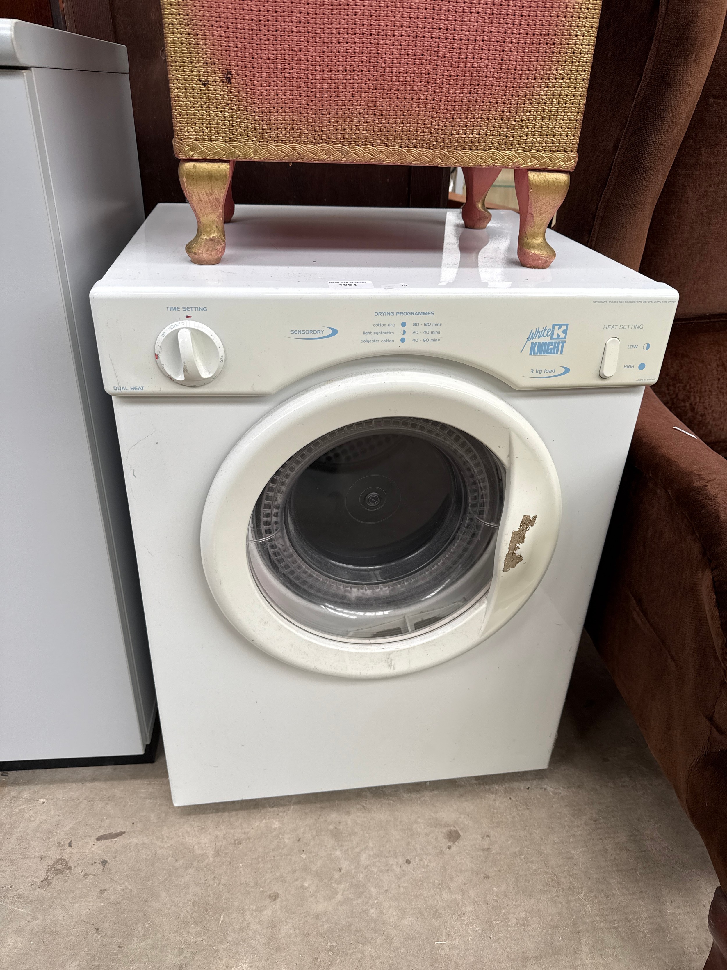 A small WHITE KNIGHT tumble dryer