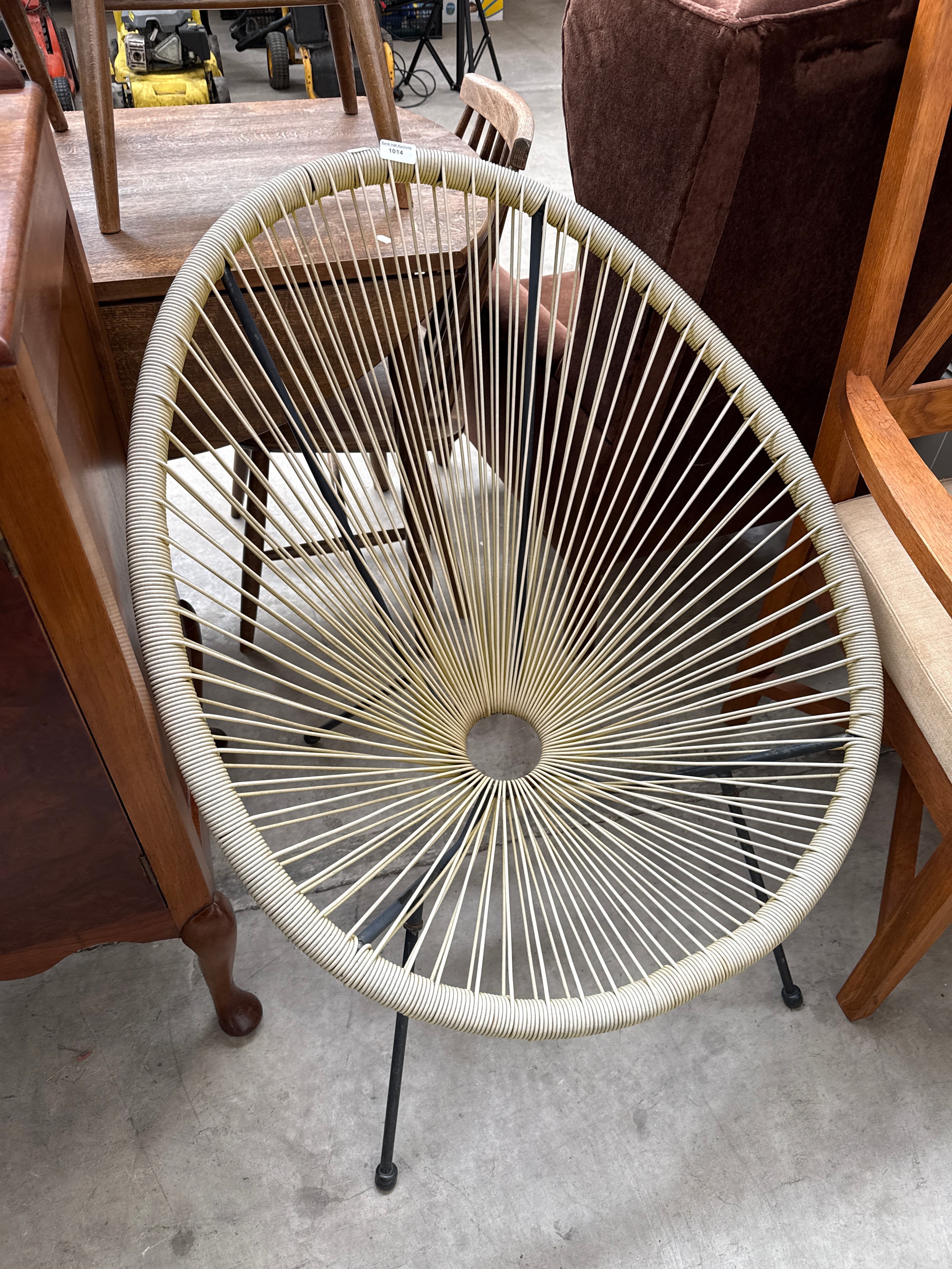 A modern metal framed strung seated chair