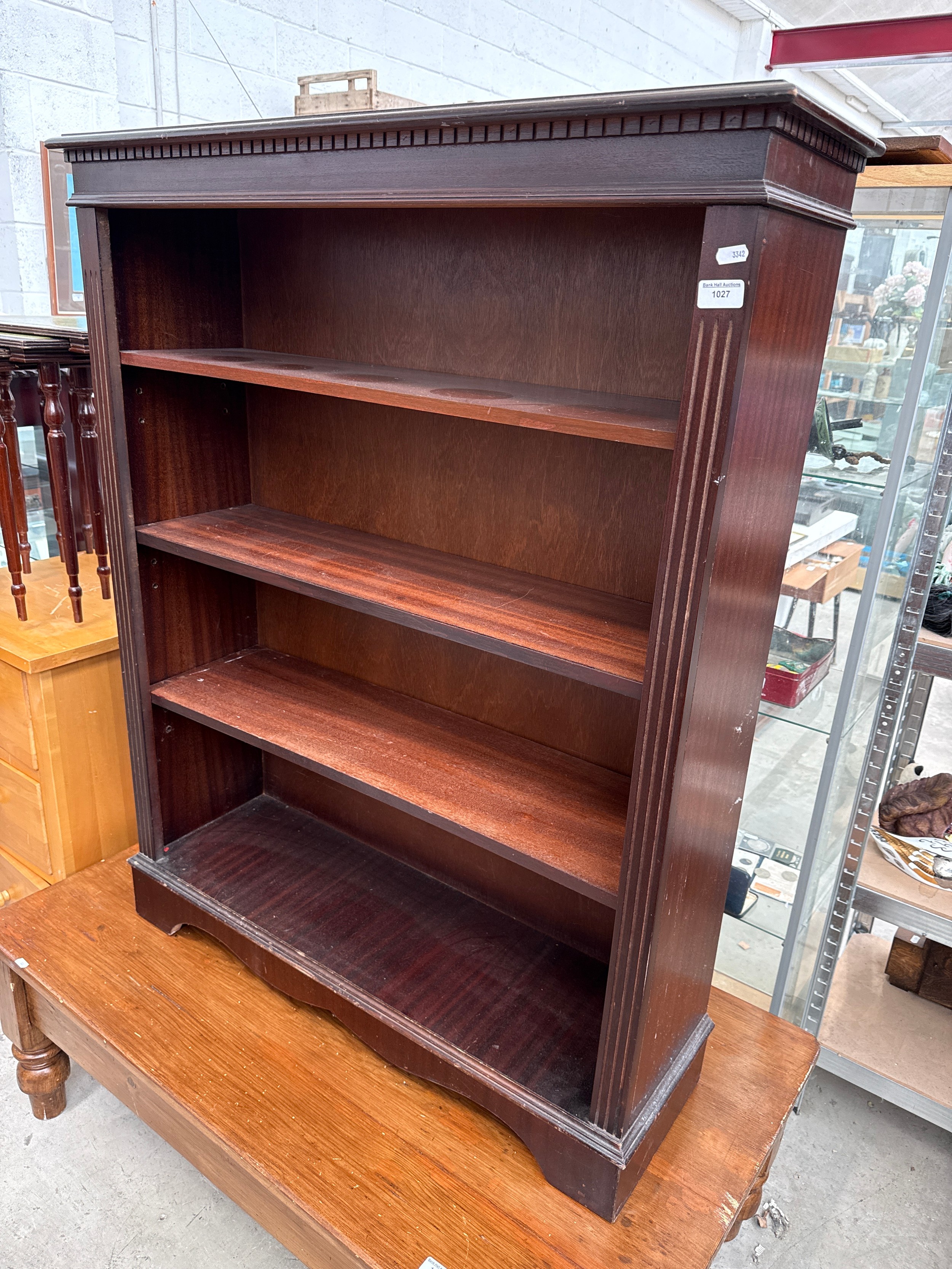 A vintage 4 tier mahogany open bookcase