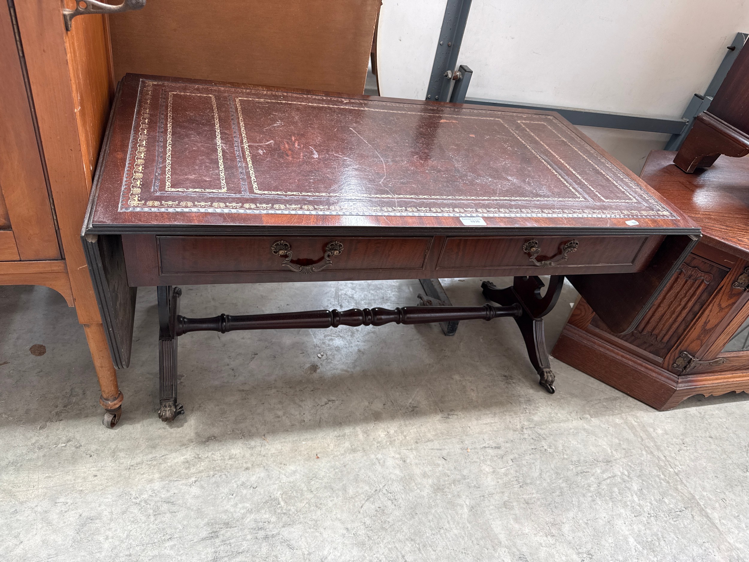 A vintage mahogany 2 drawer leather topped drop leaf Sofa Table