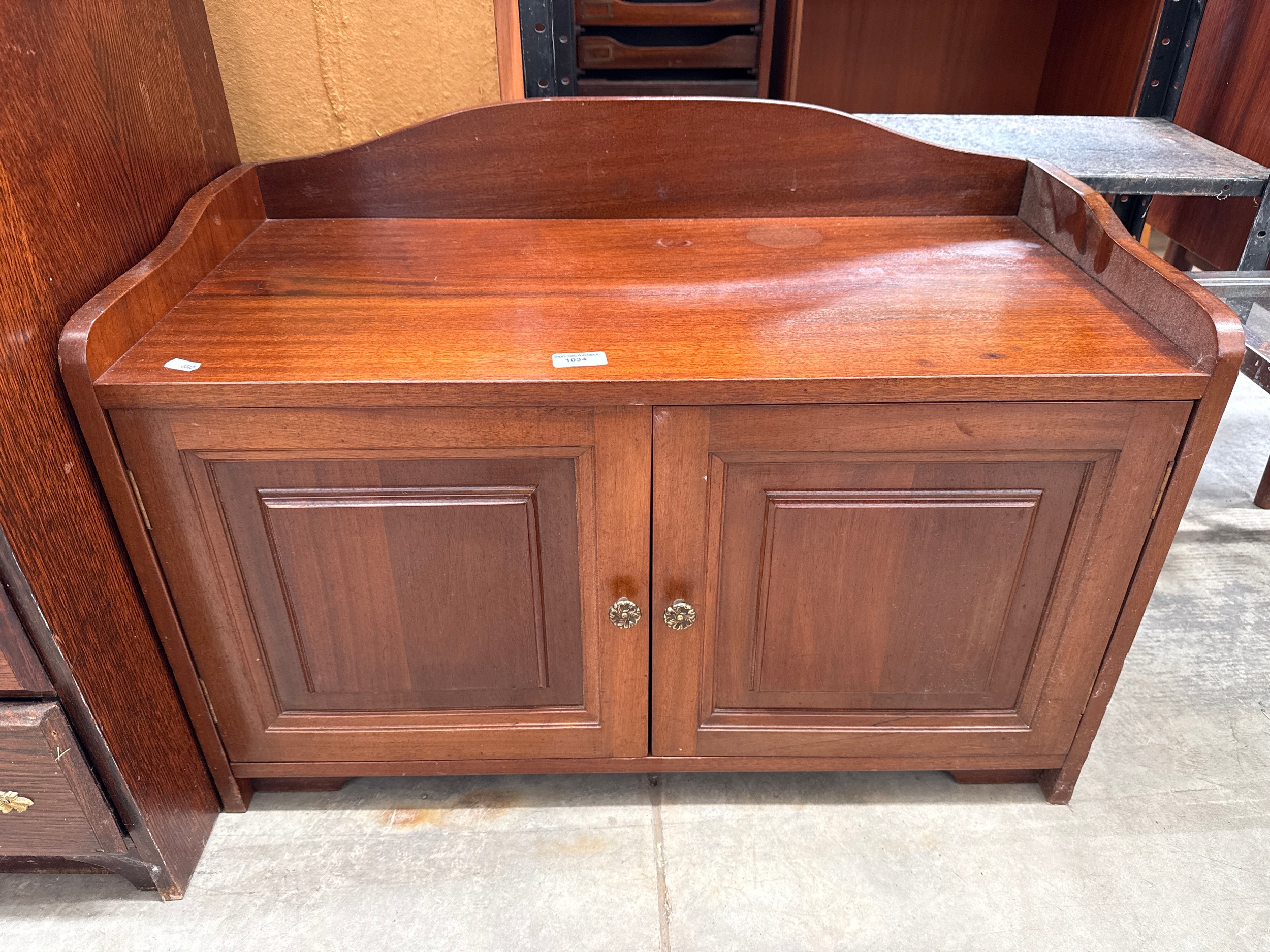 A vintage 2 door mahogany bench seat cupboard