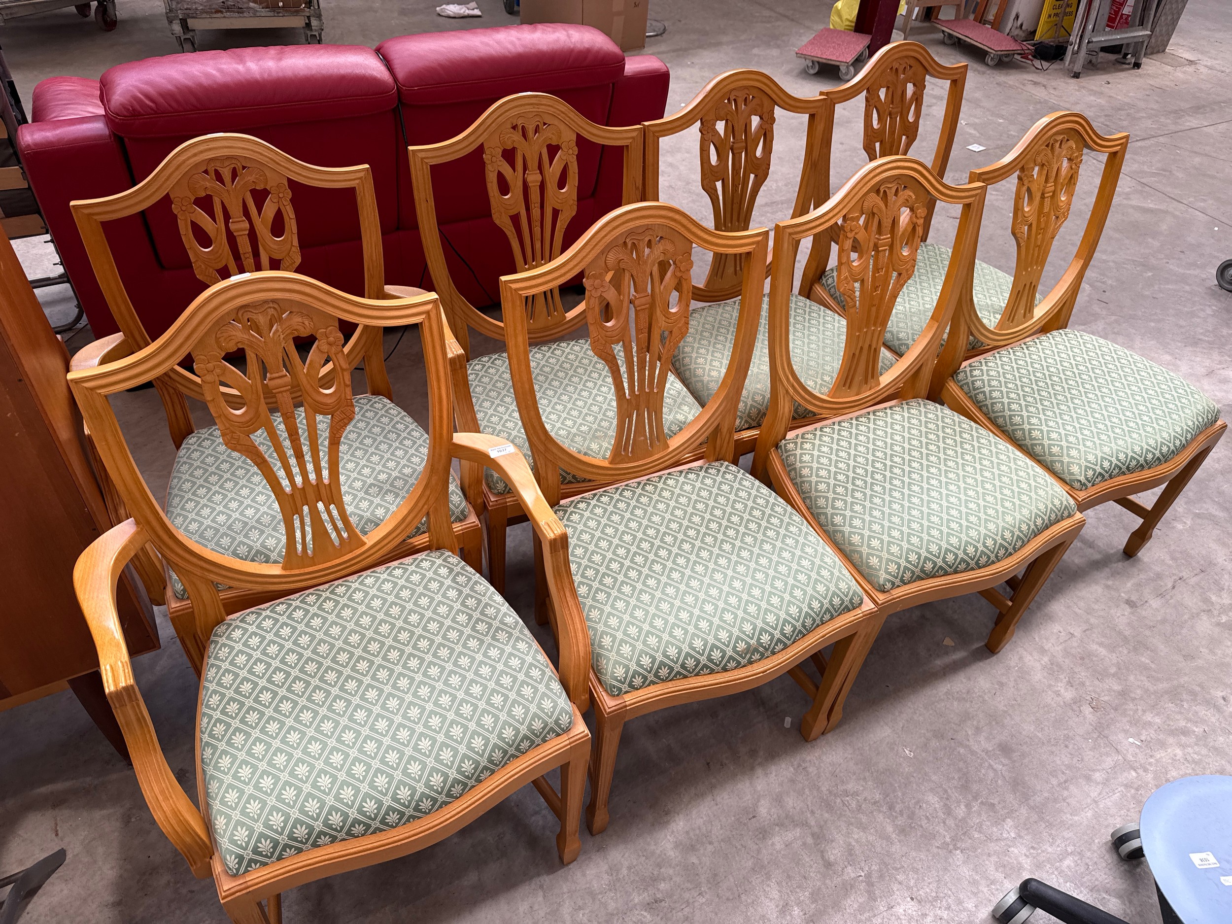 A set of 8 x carved shield back dining chairs with upholstered seats