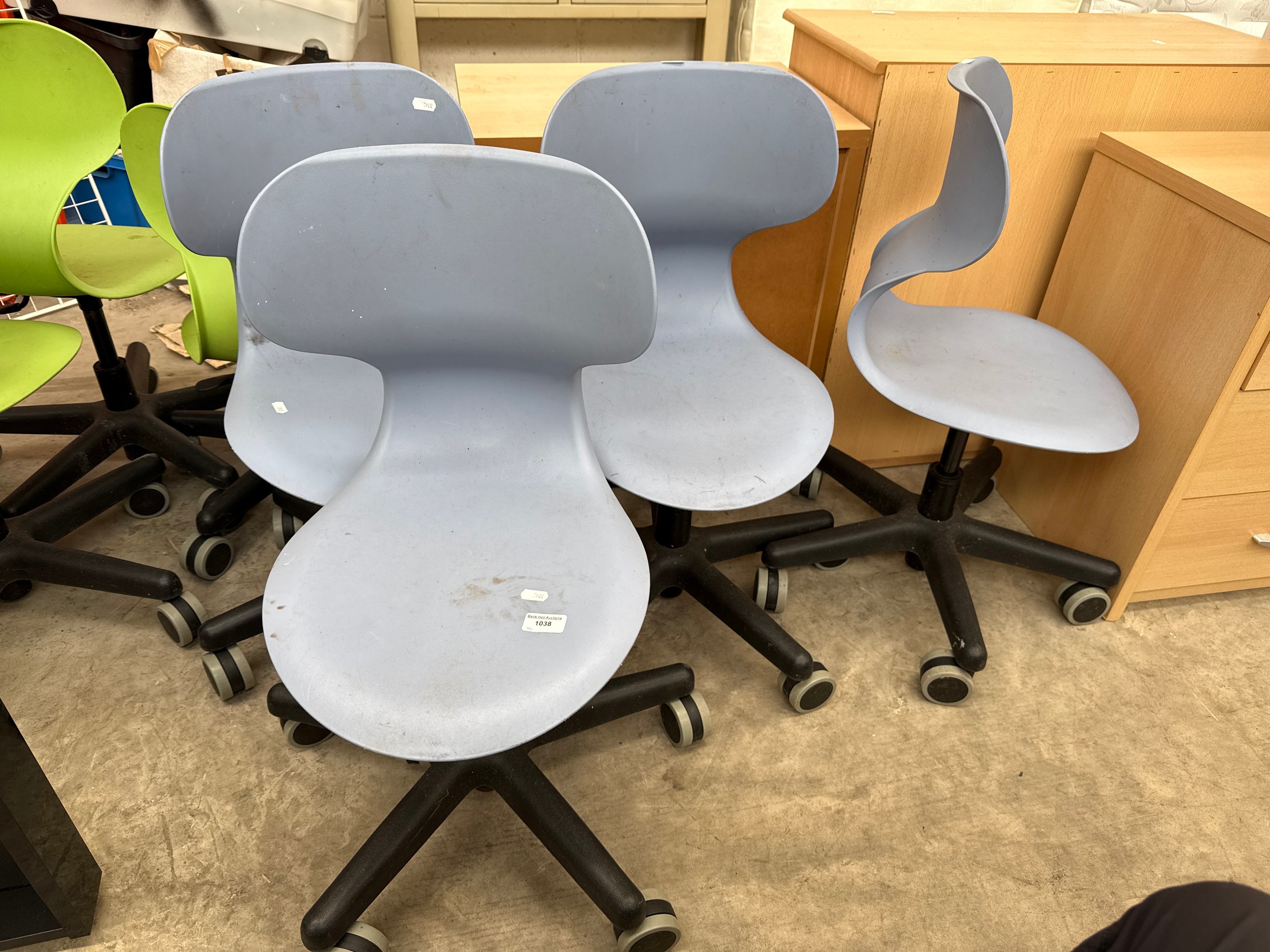 A set of 4 x small plastic seated adjustable swivel chairs