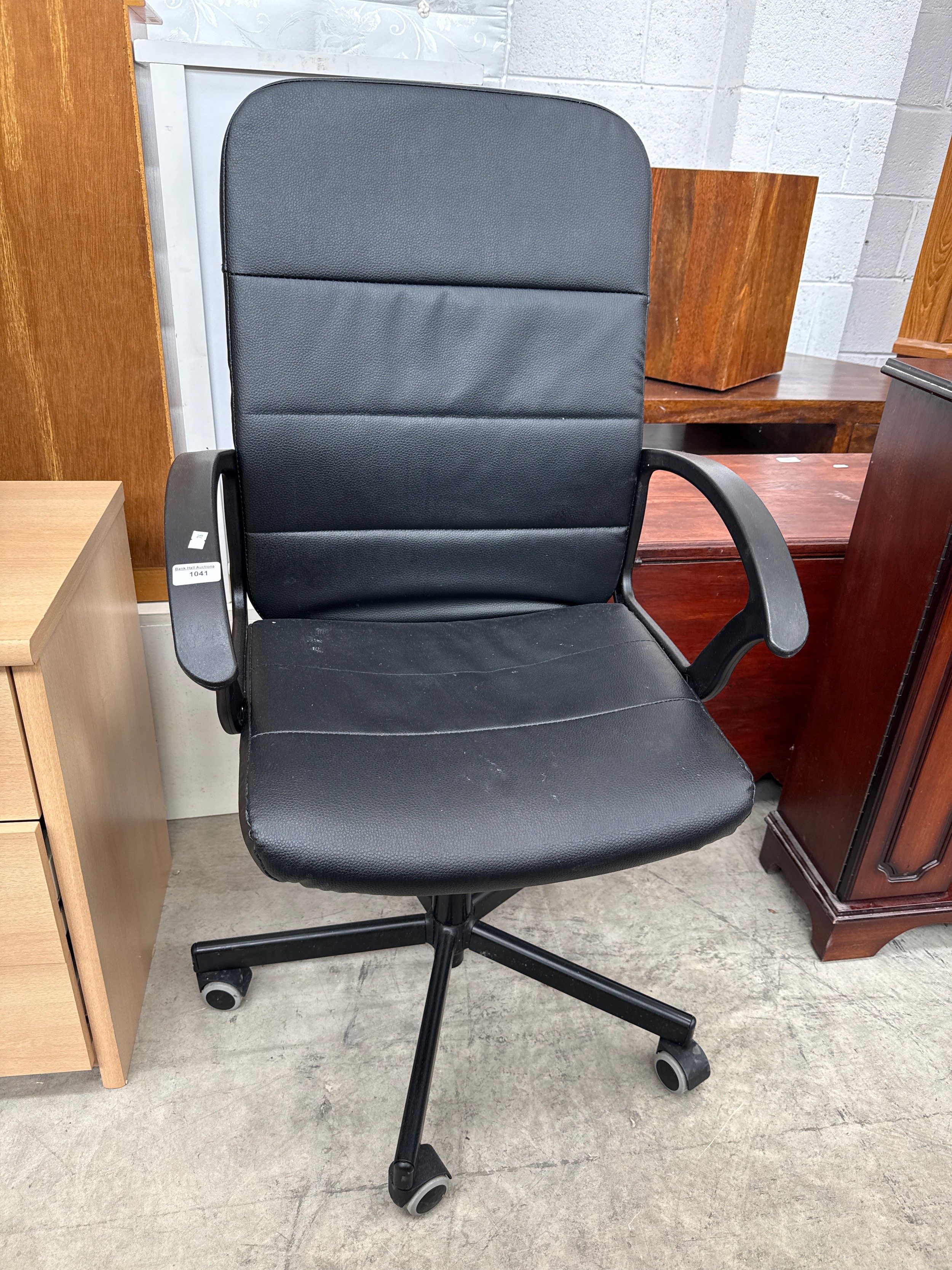 A padded swivel office chair