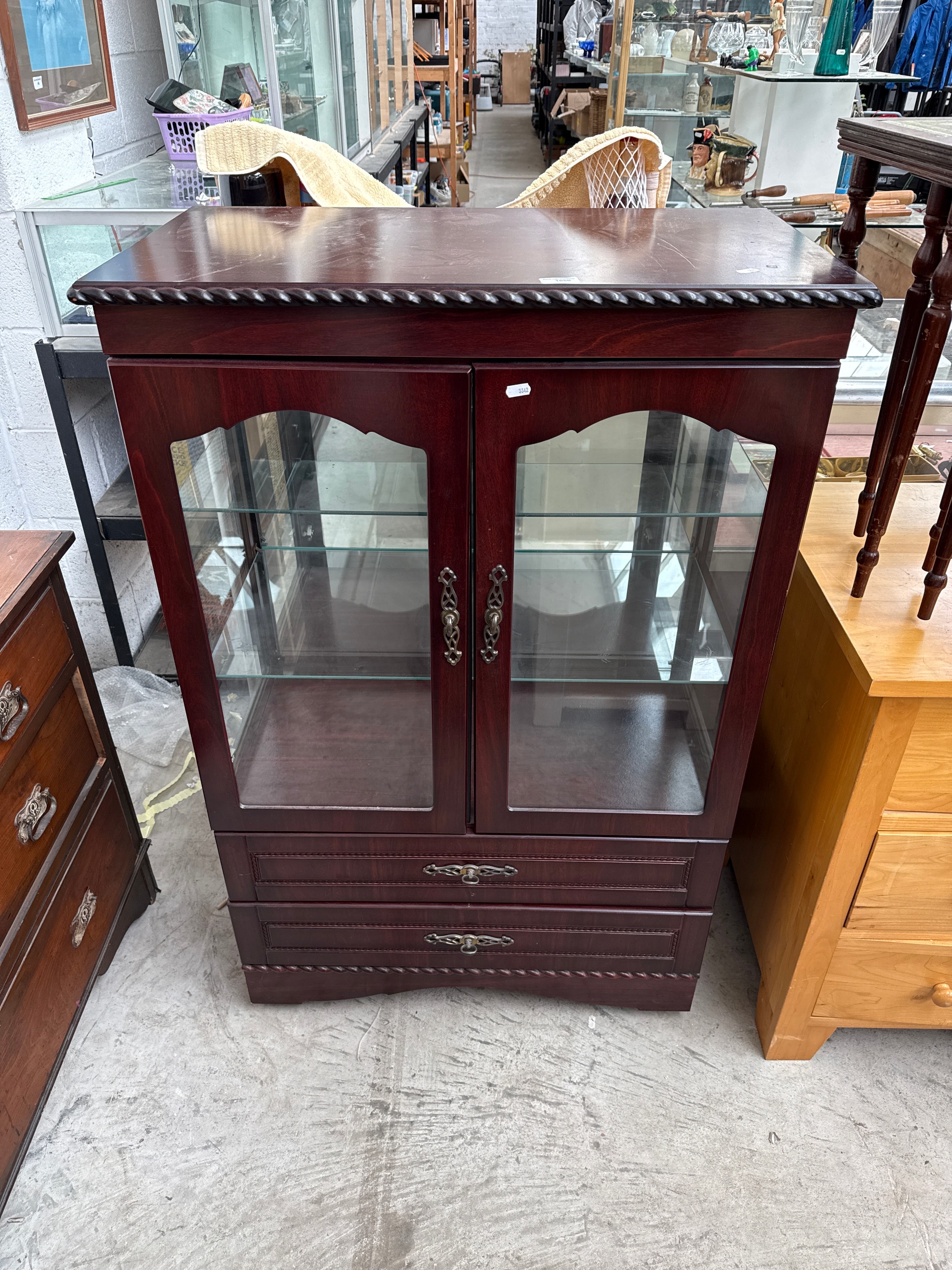 A large vintage glazed mahogany cabinet with 2 x lower drawers