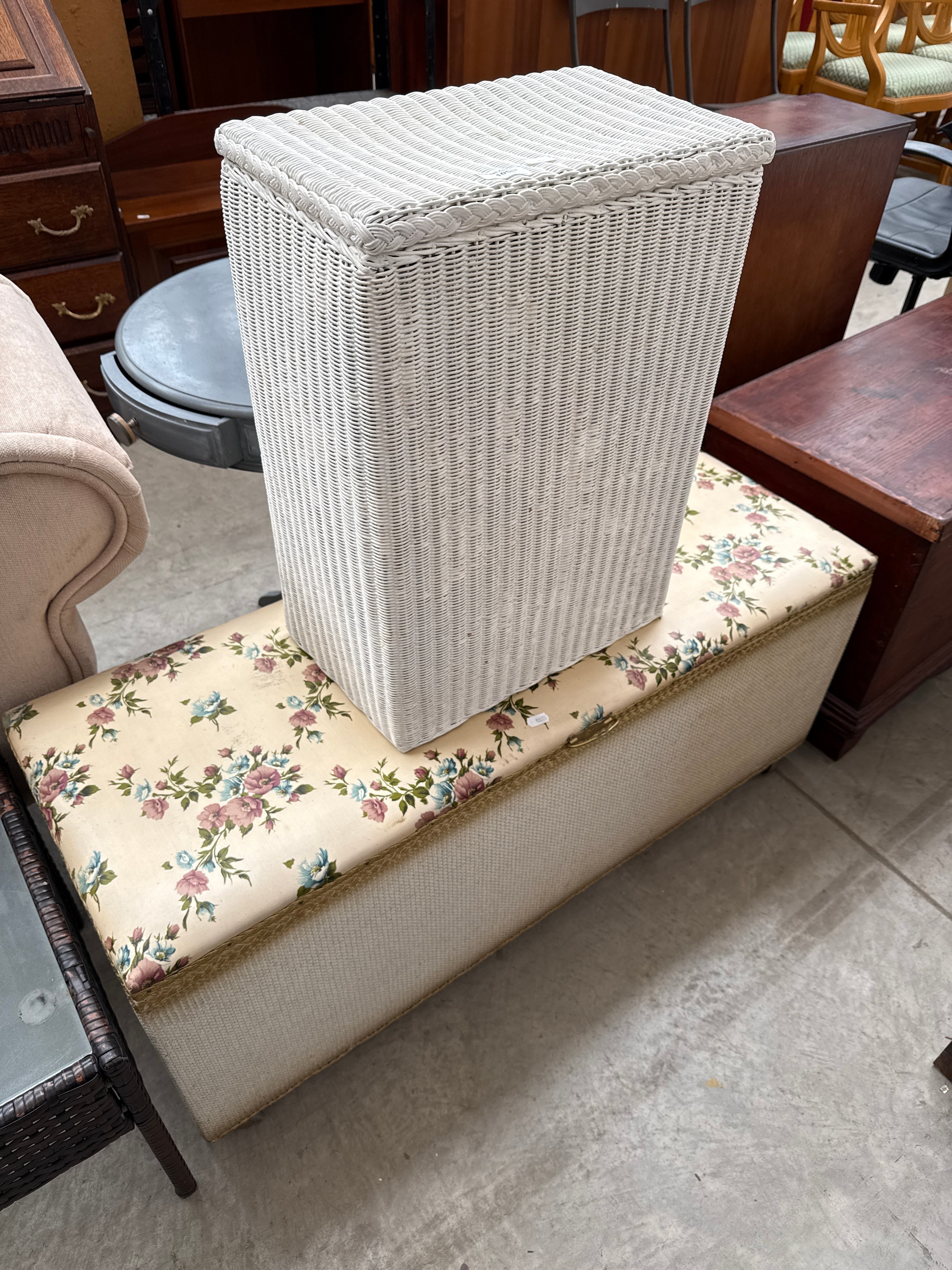 A small vintage painted linen basket and a large blanket box with upholstered