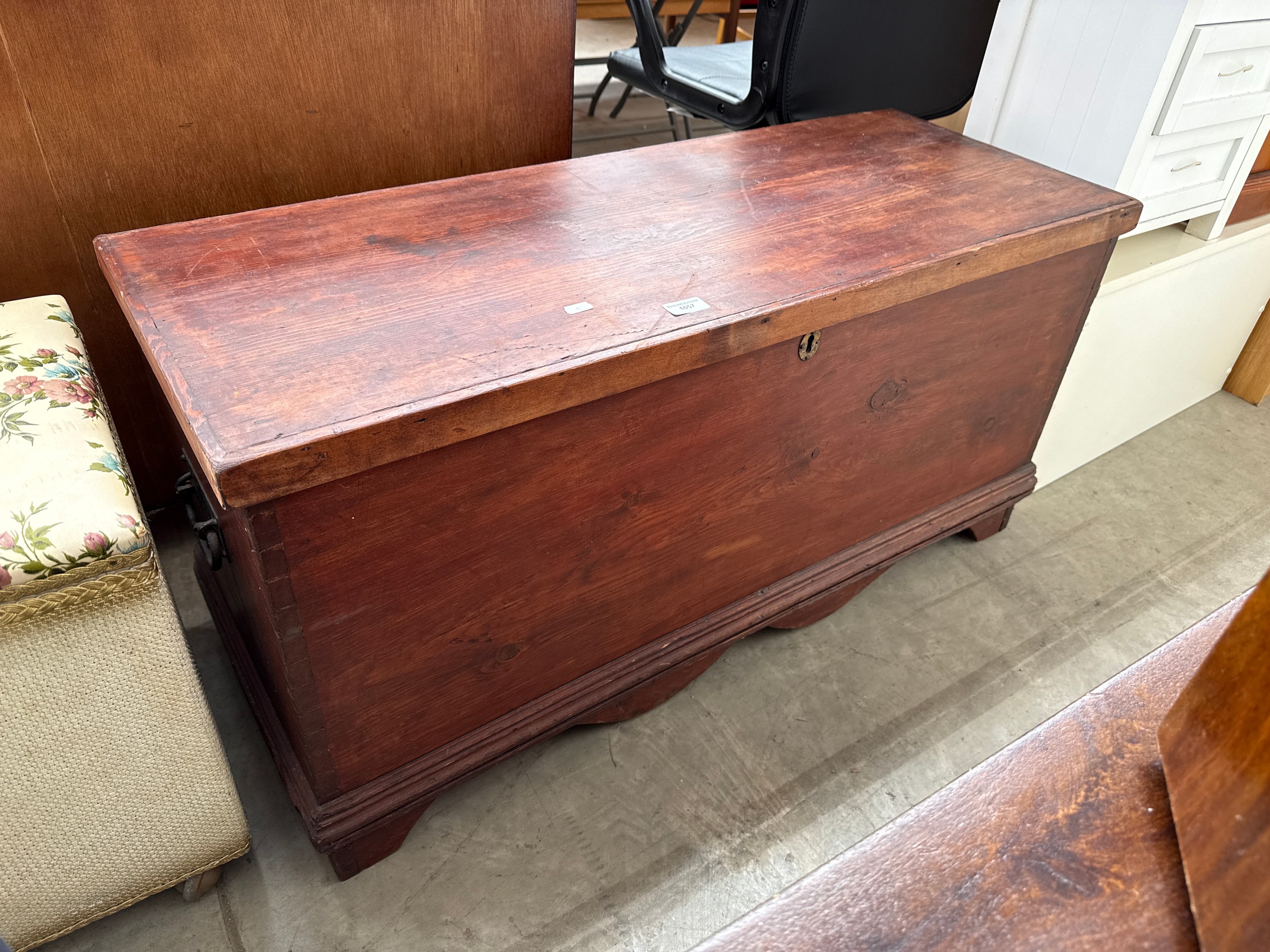 A vintage stained lift top storage box