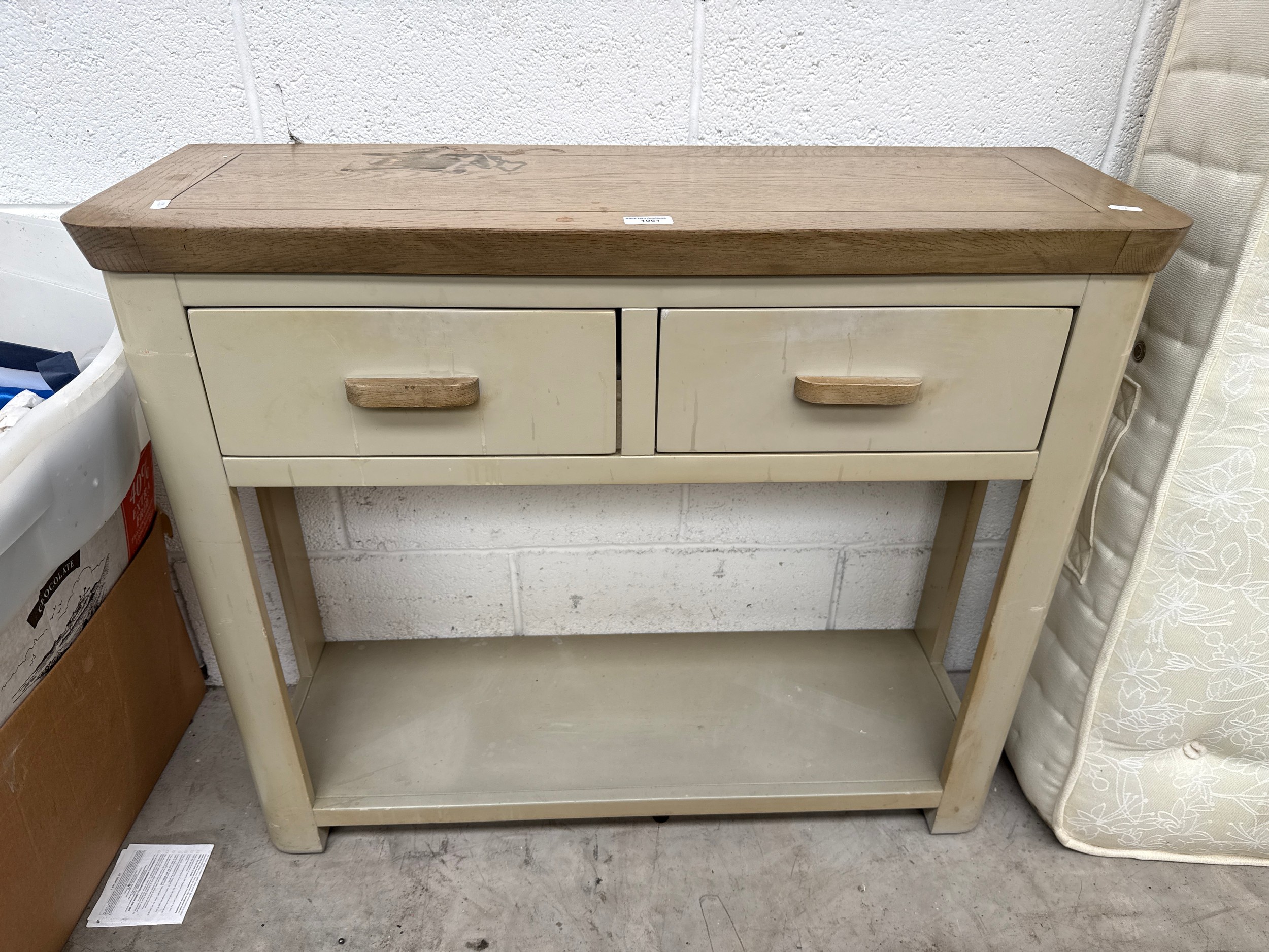 A 2 drawer console stand for refinish