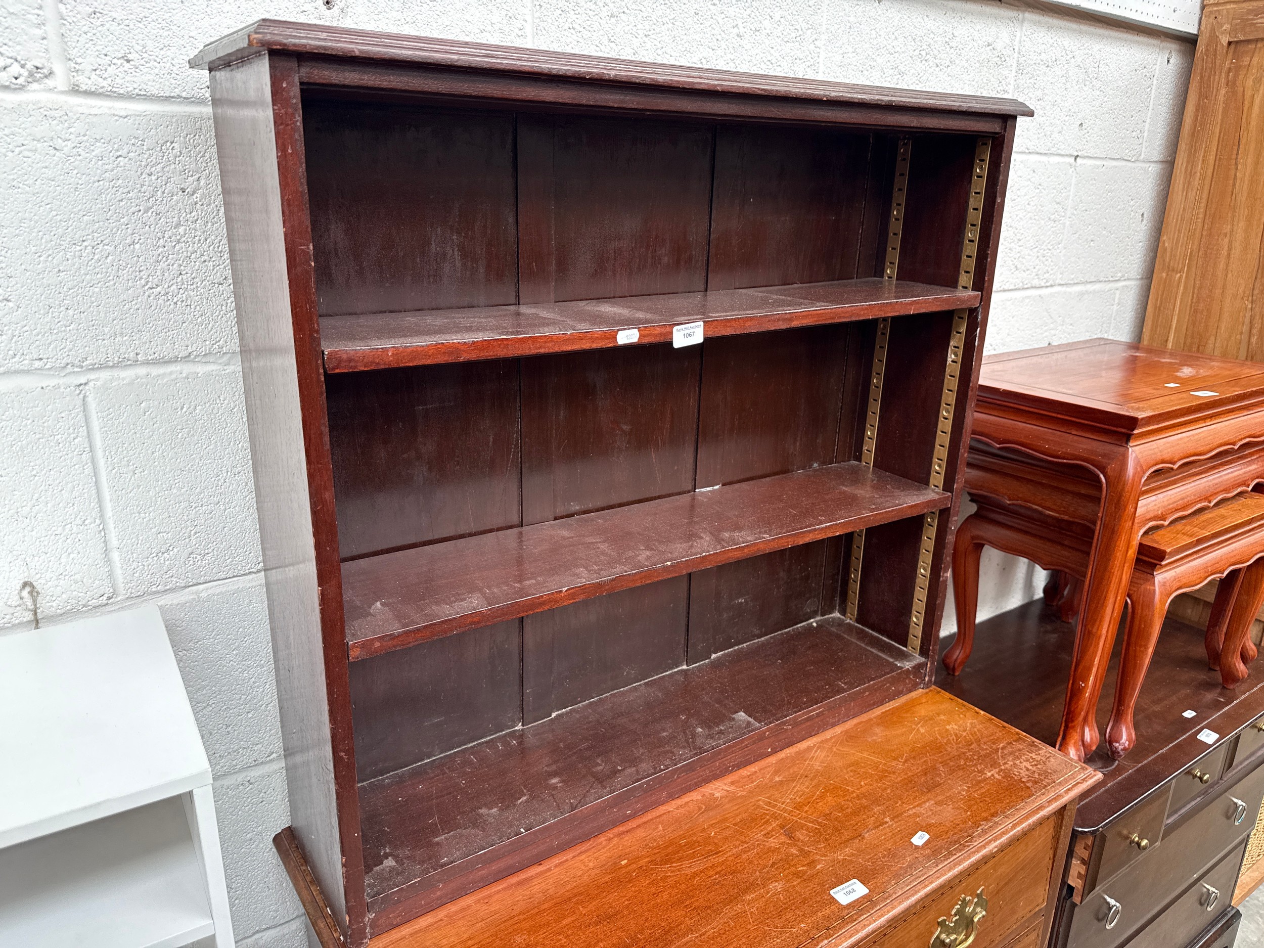 A small vintage mahogany open bookcase