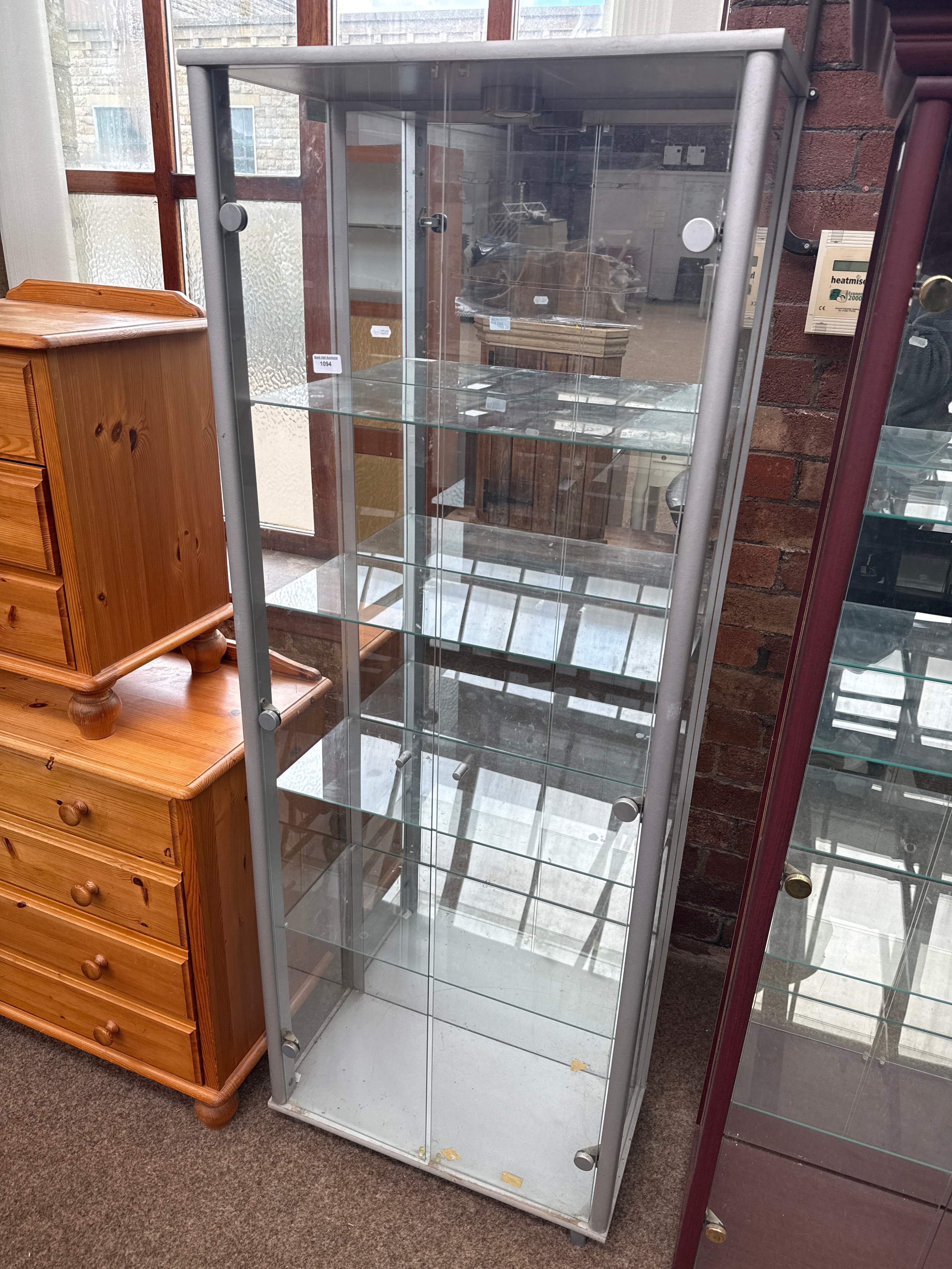 A large glazed 2 door display case