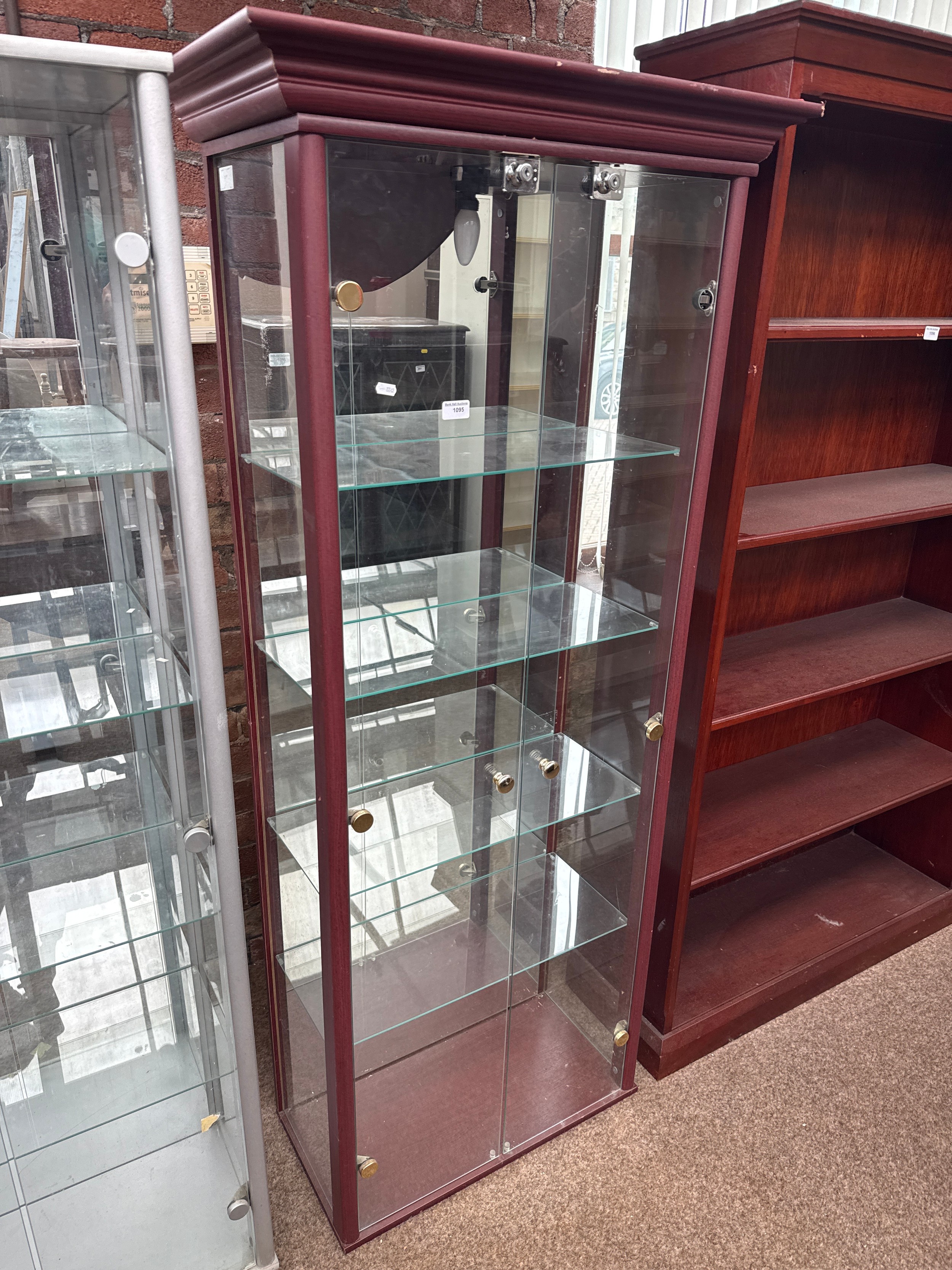 A large glazed 2 door display case