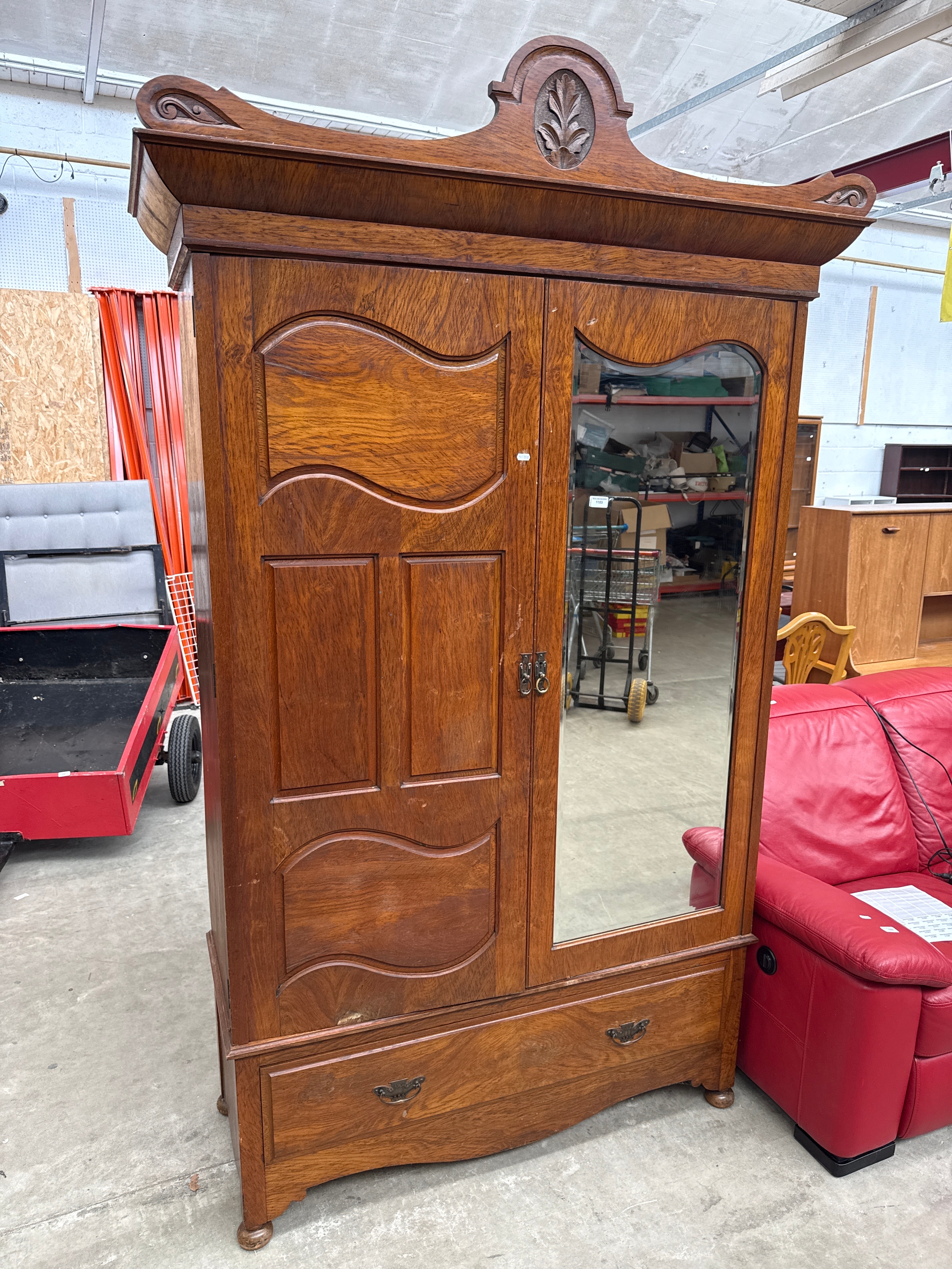A very large vintage two door wardrobe with drawer to the bottom
