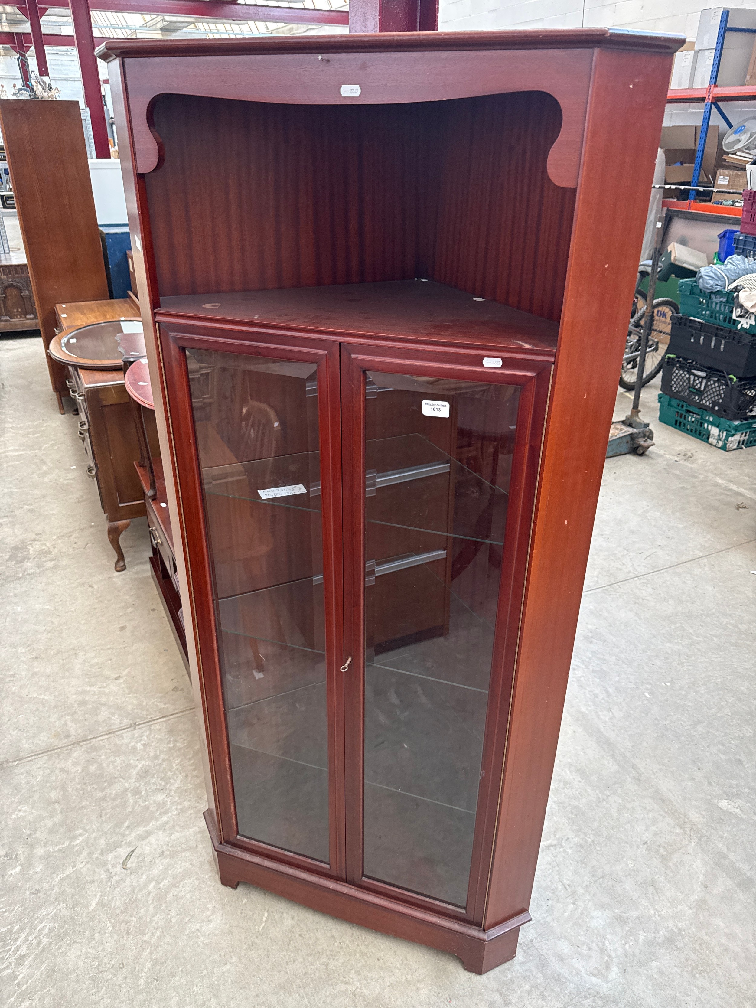 A large glazed mahogany 2 door corner cabinet