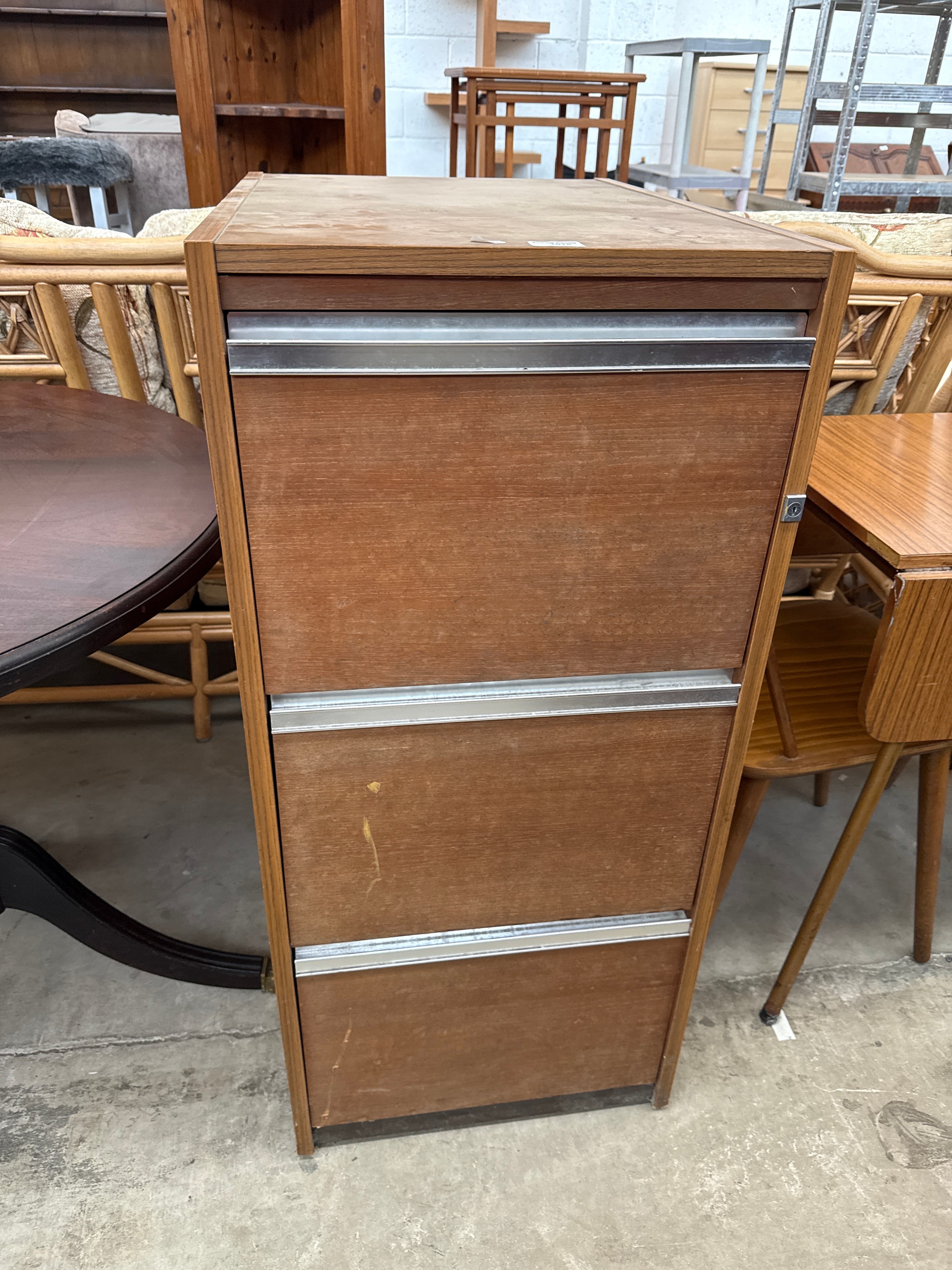 A vintage 3 drawer wooden filing cabinet