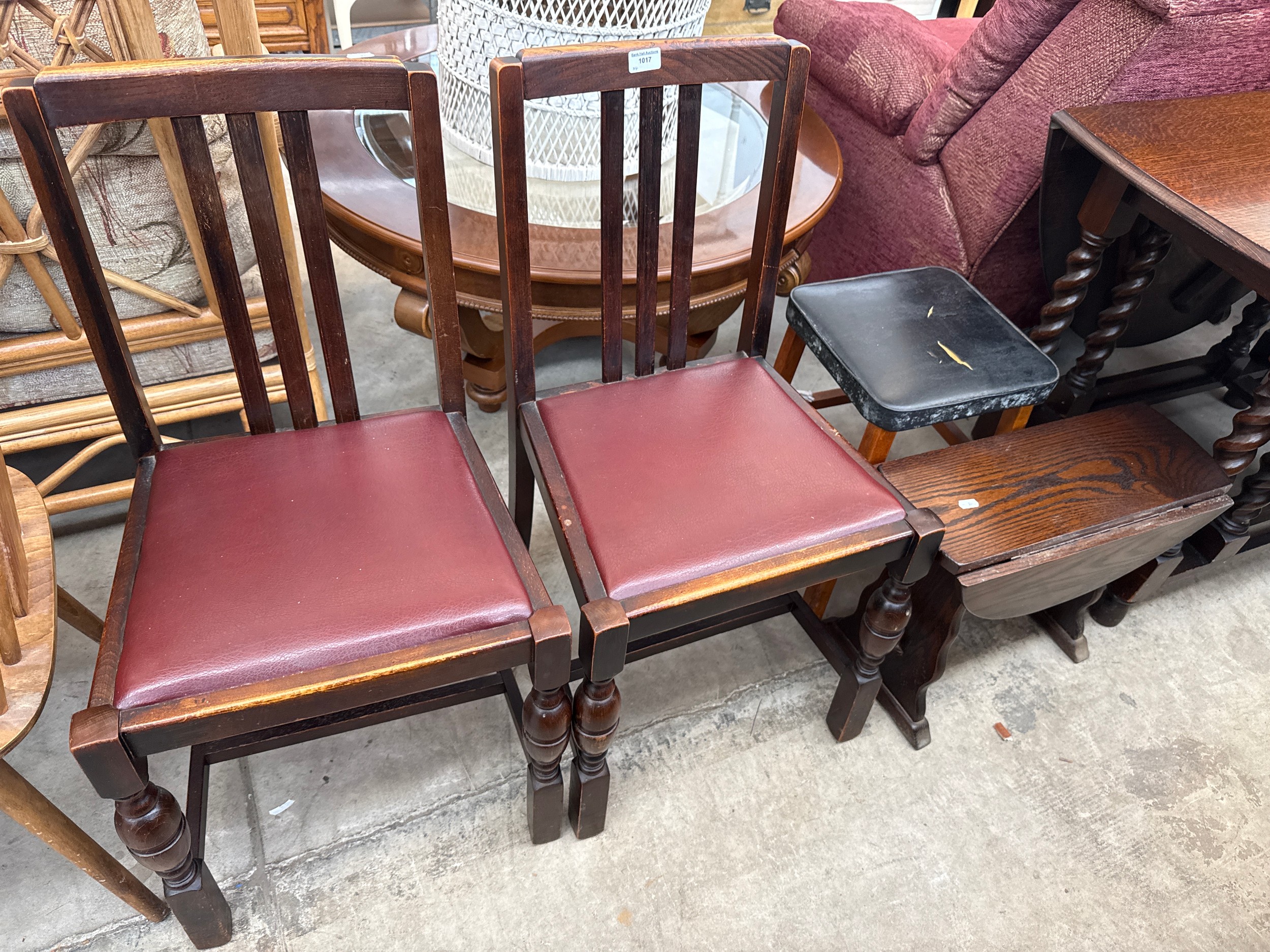 A pair of vintage bulbous legged dining chairs