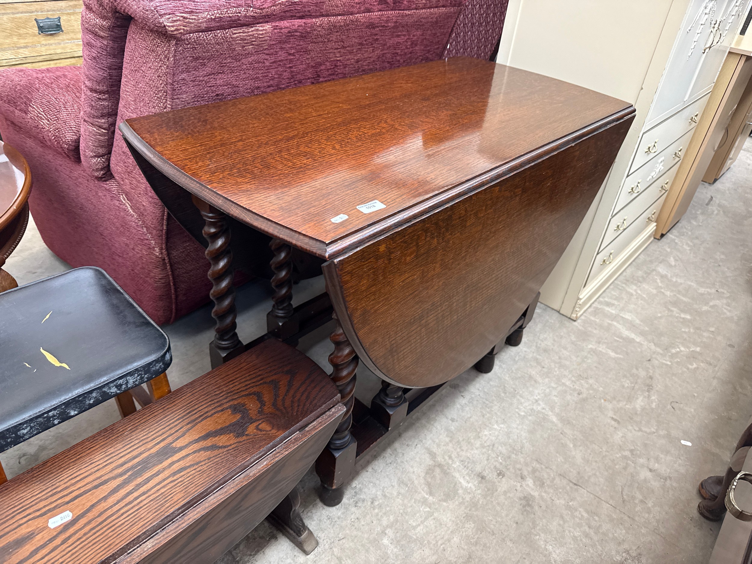 A large vintage oak gate leg Barley twist legged dining table