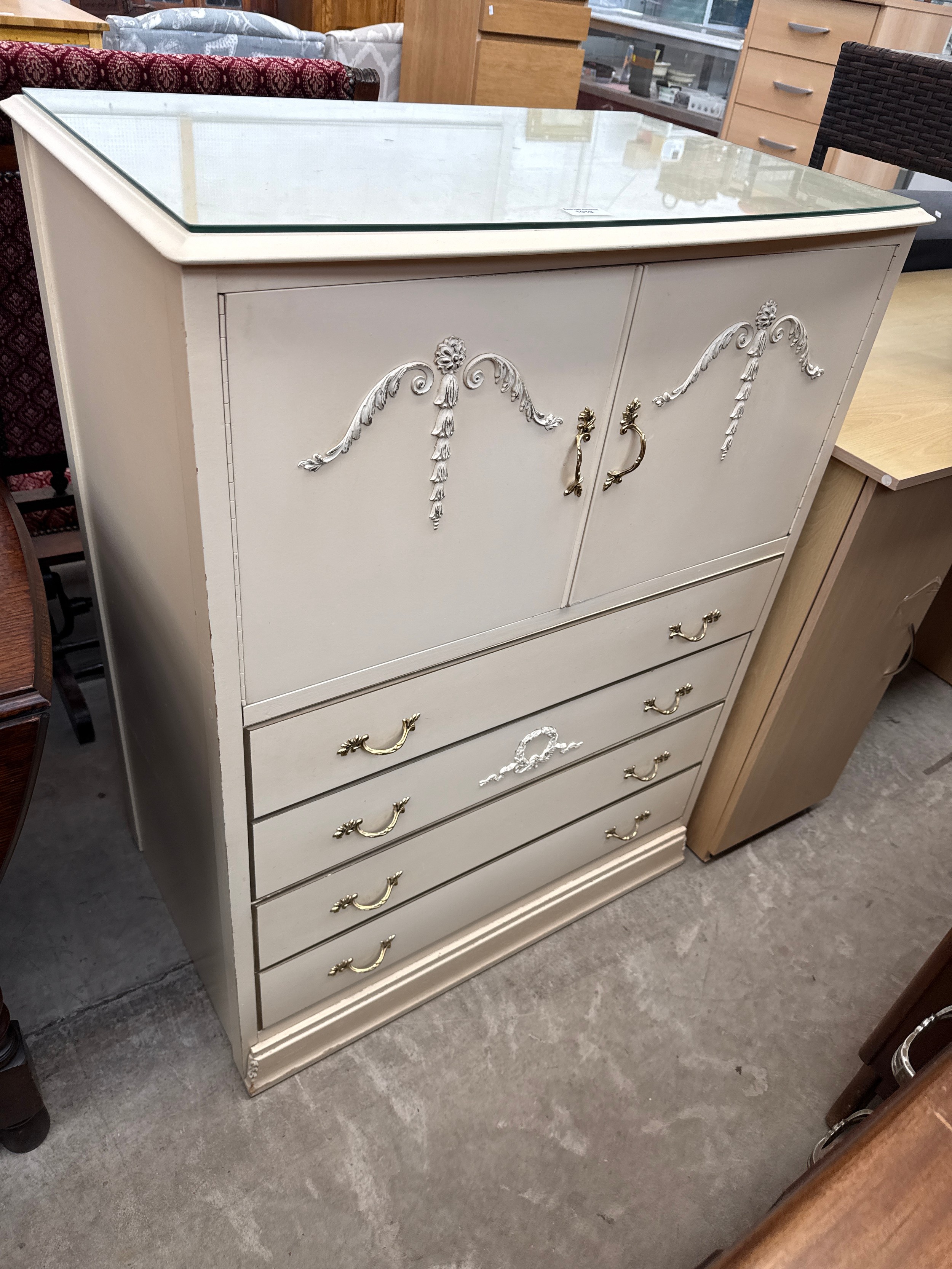 A vintage 4 drawer continental style tallboy with glass top