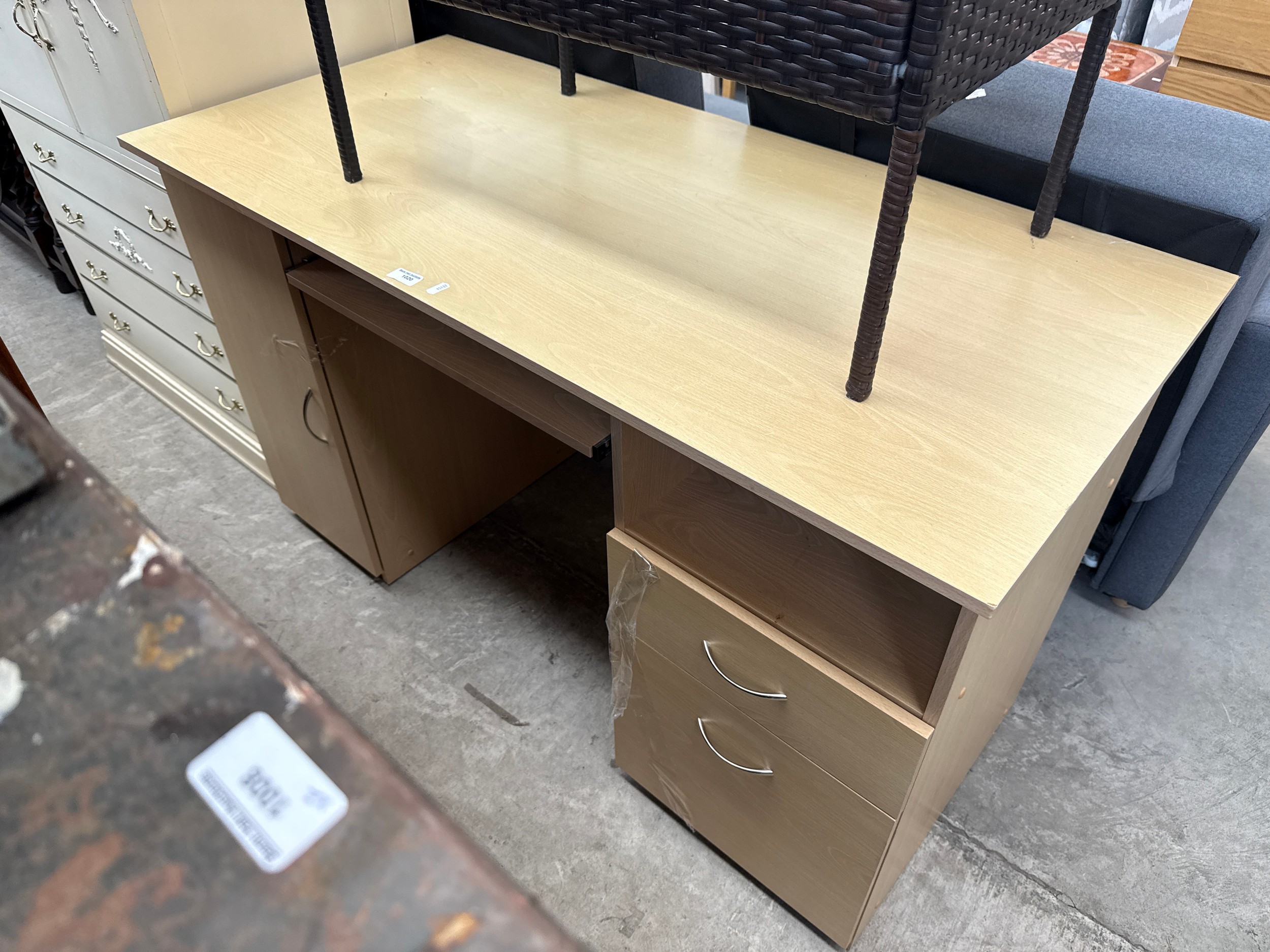 A large modern 2 drawer computer desk with pull-out keyboard shelf