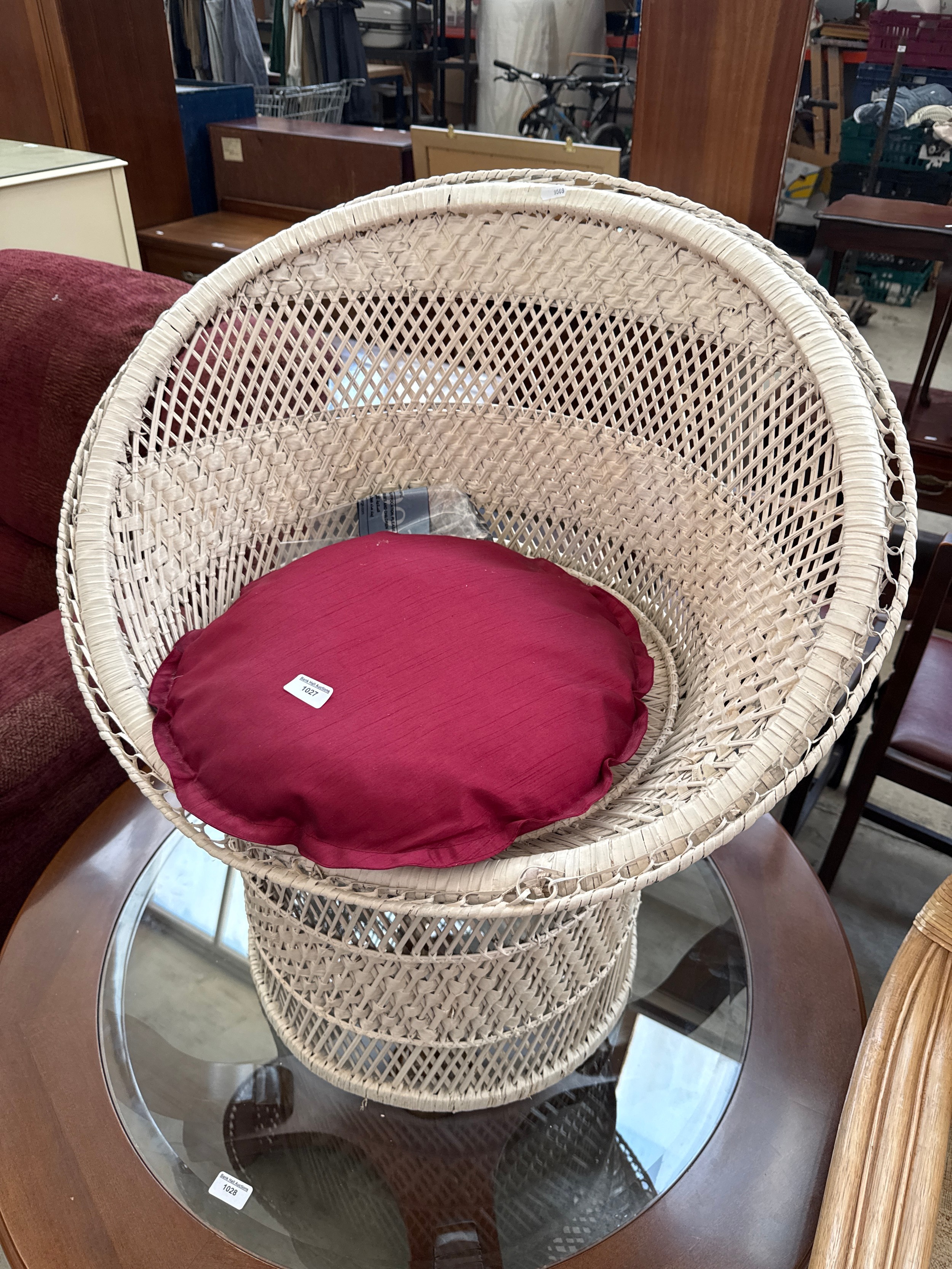 A painted vintage wicker tub chair with cushion