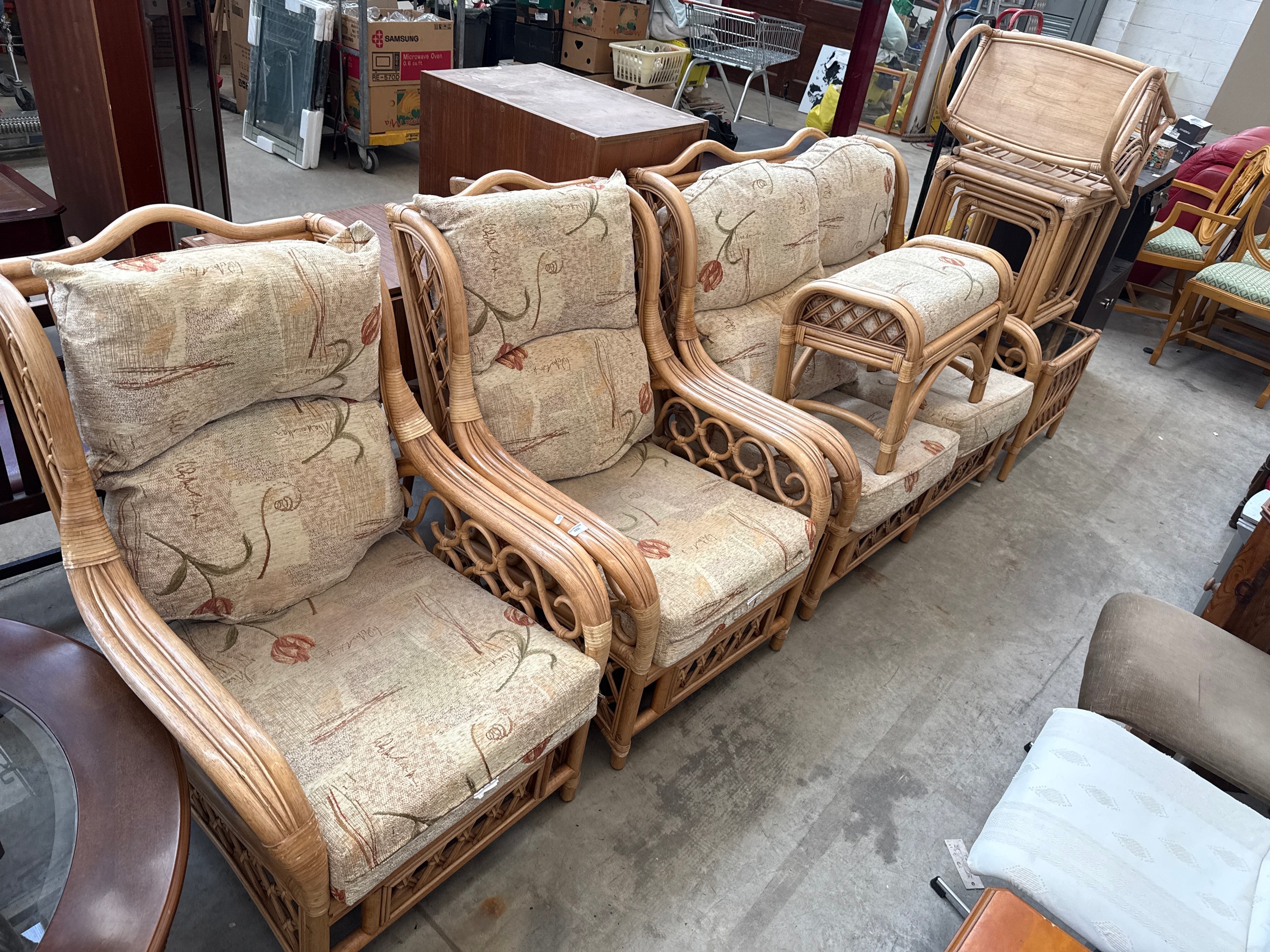 A 7 x piece cane framed conservatory suite including settee, armchairs