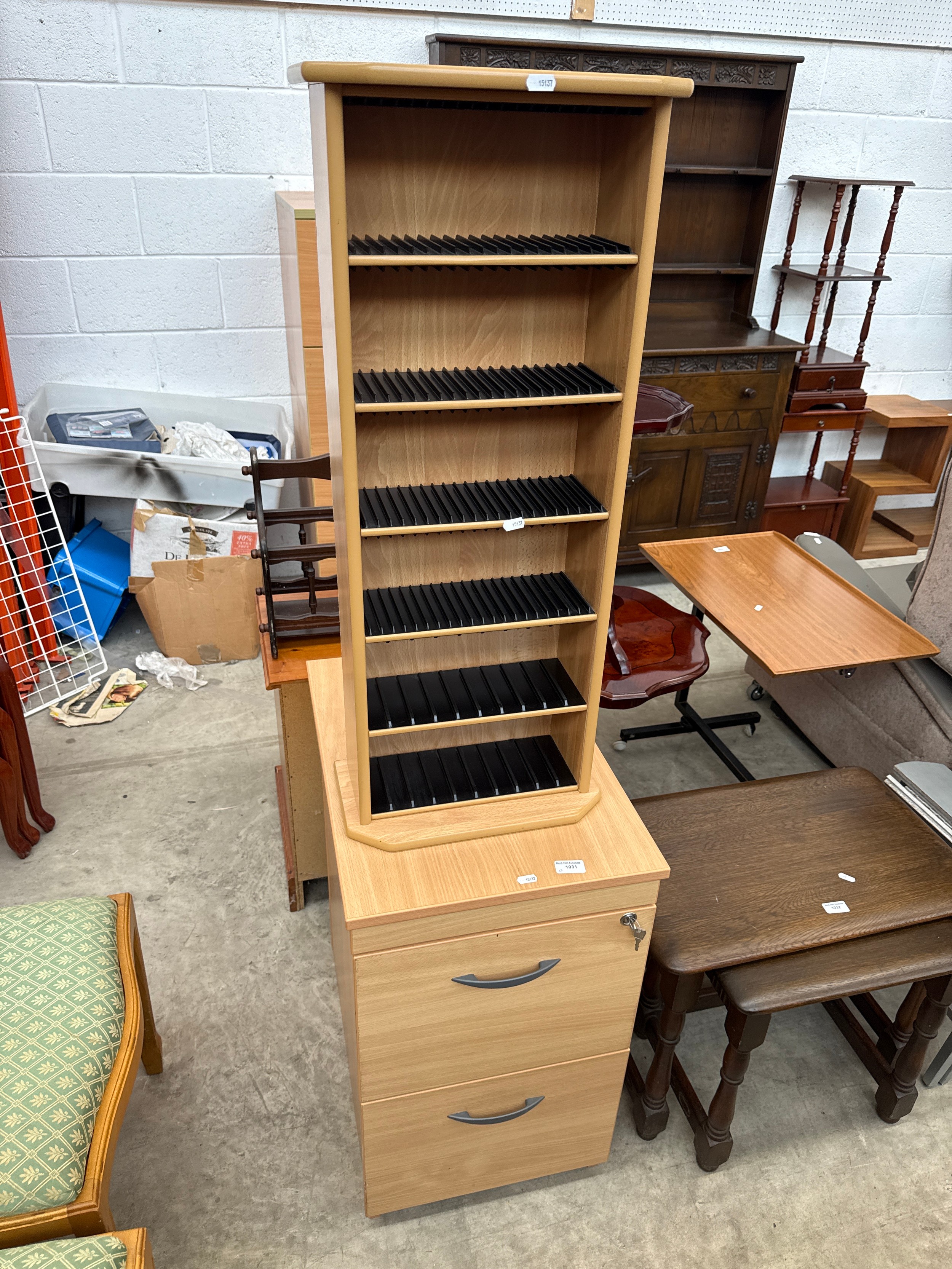 A lockable 2 drawer filing cabinet and a CD/DVD storage tower