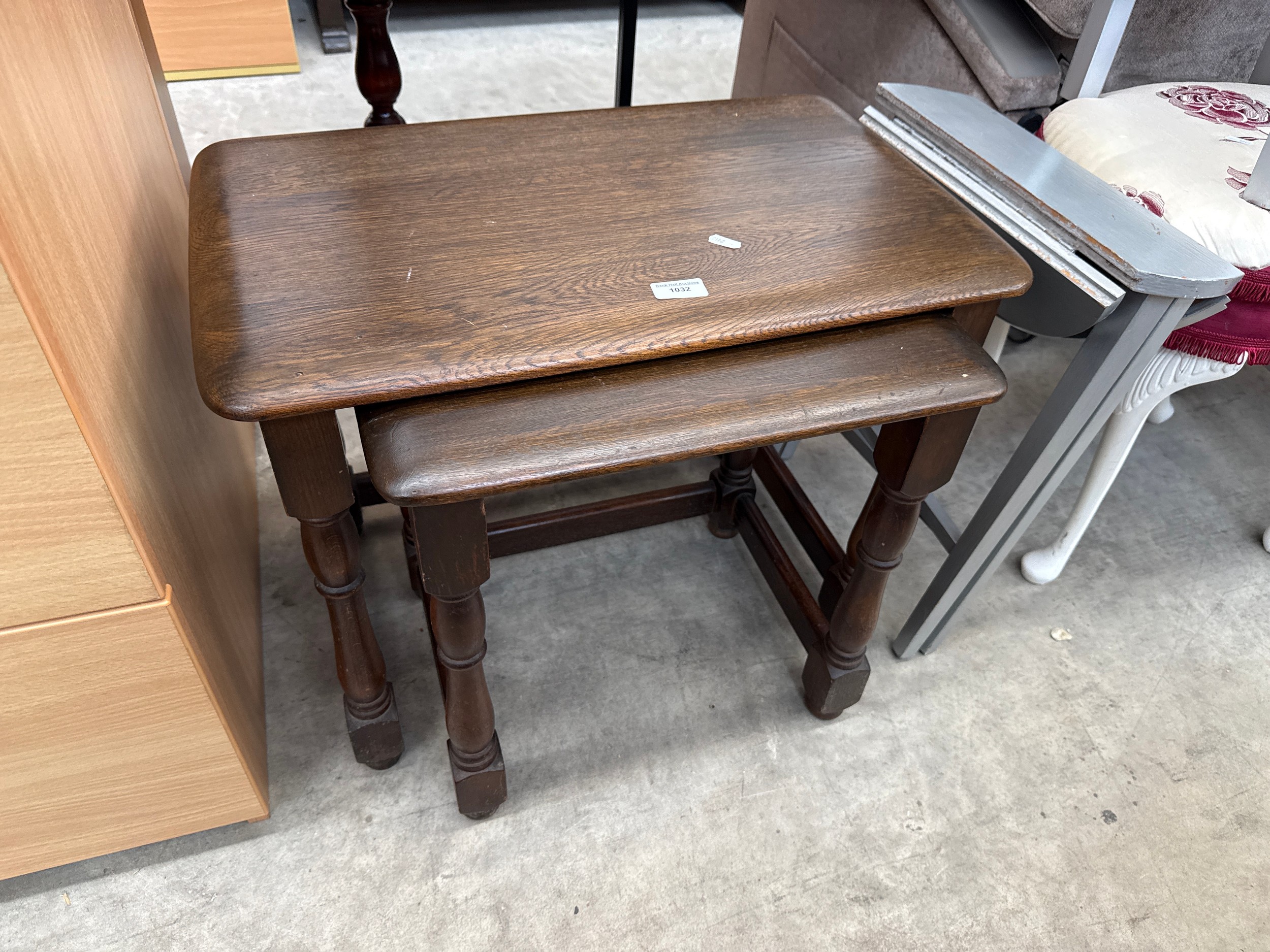 A pair of nested vintage wooden occasional tables