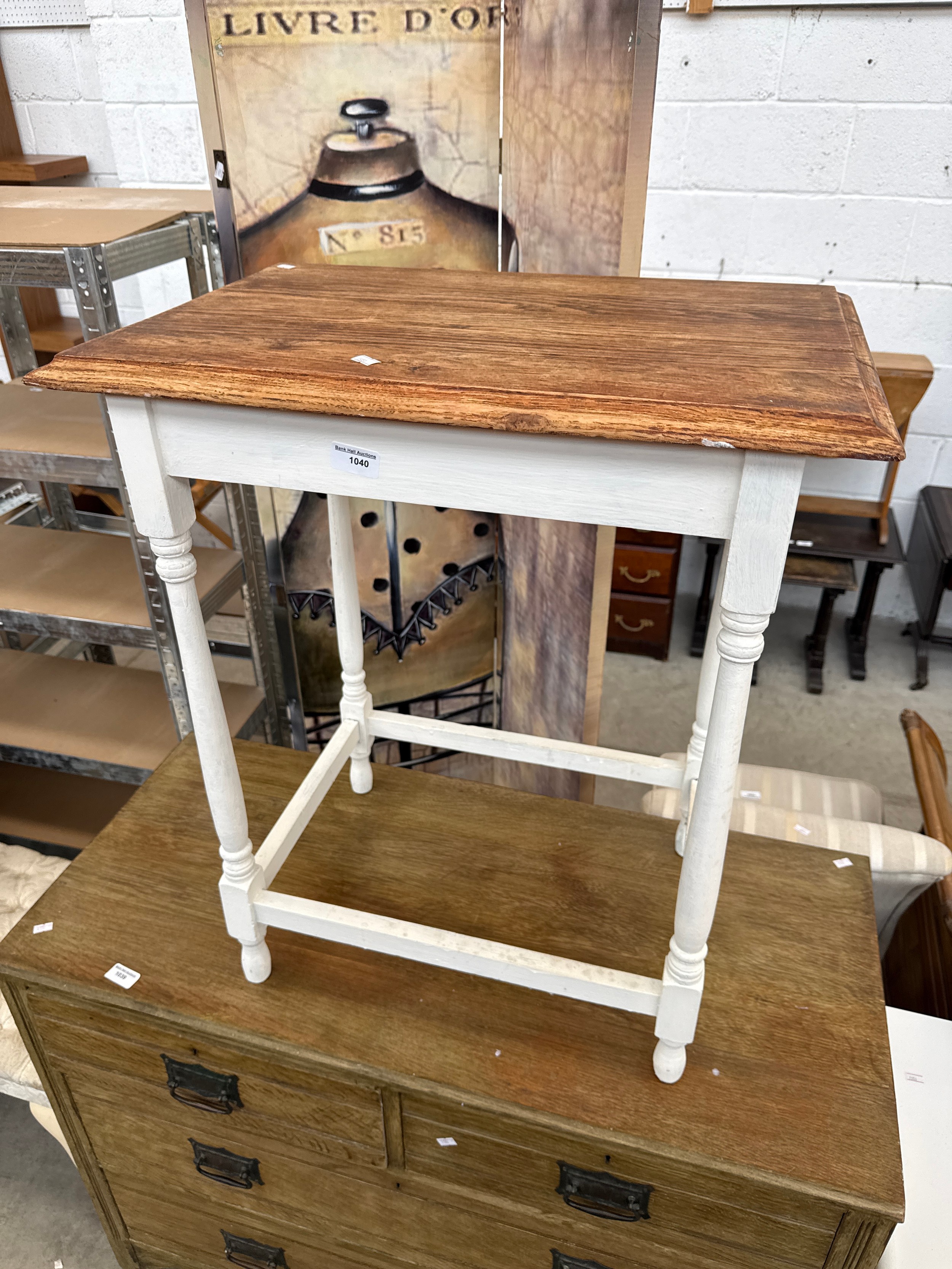A small vintage table with painted base