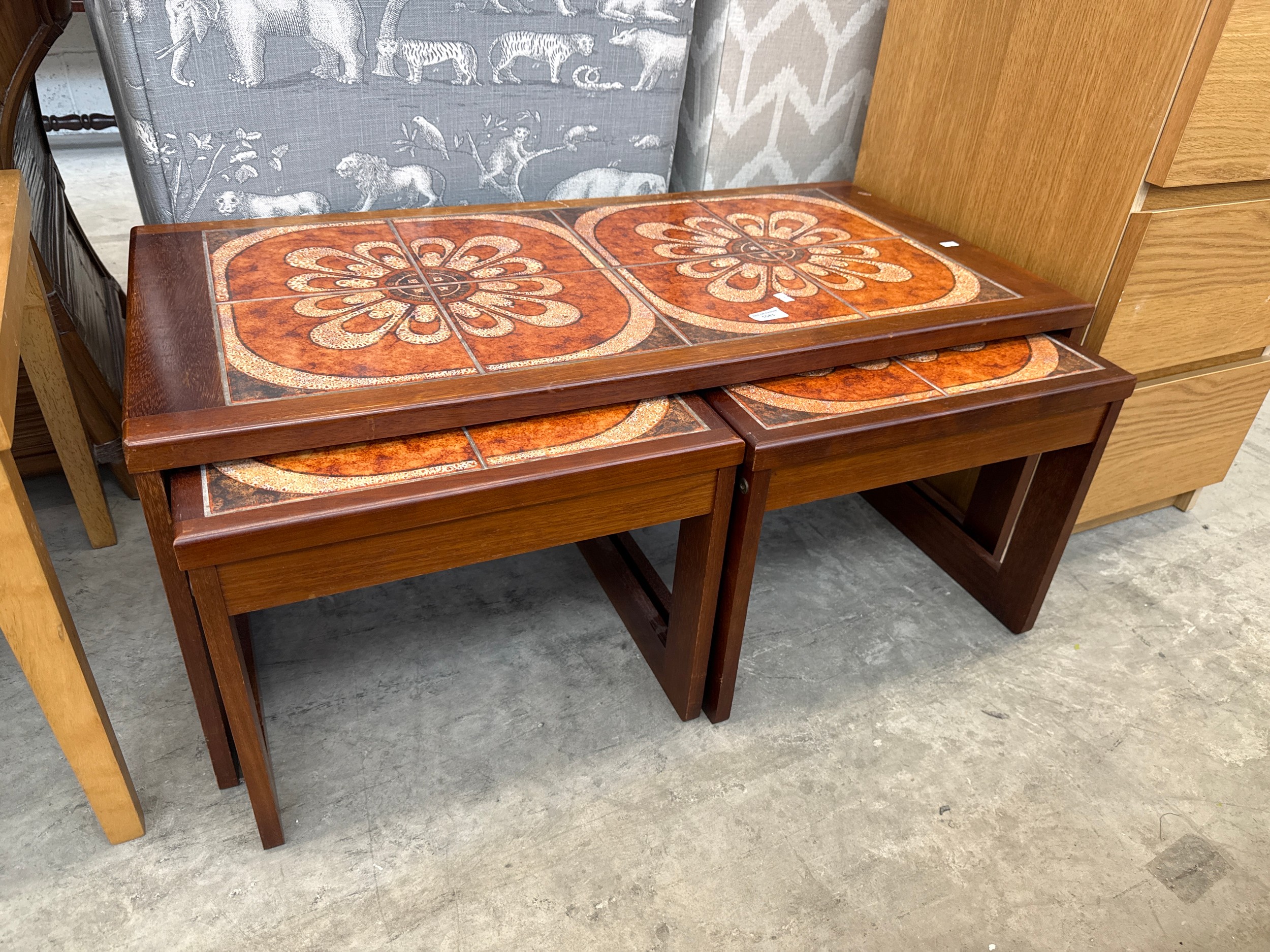 A retro tile topped coffee table with 2 x nested tables