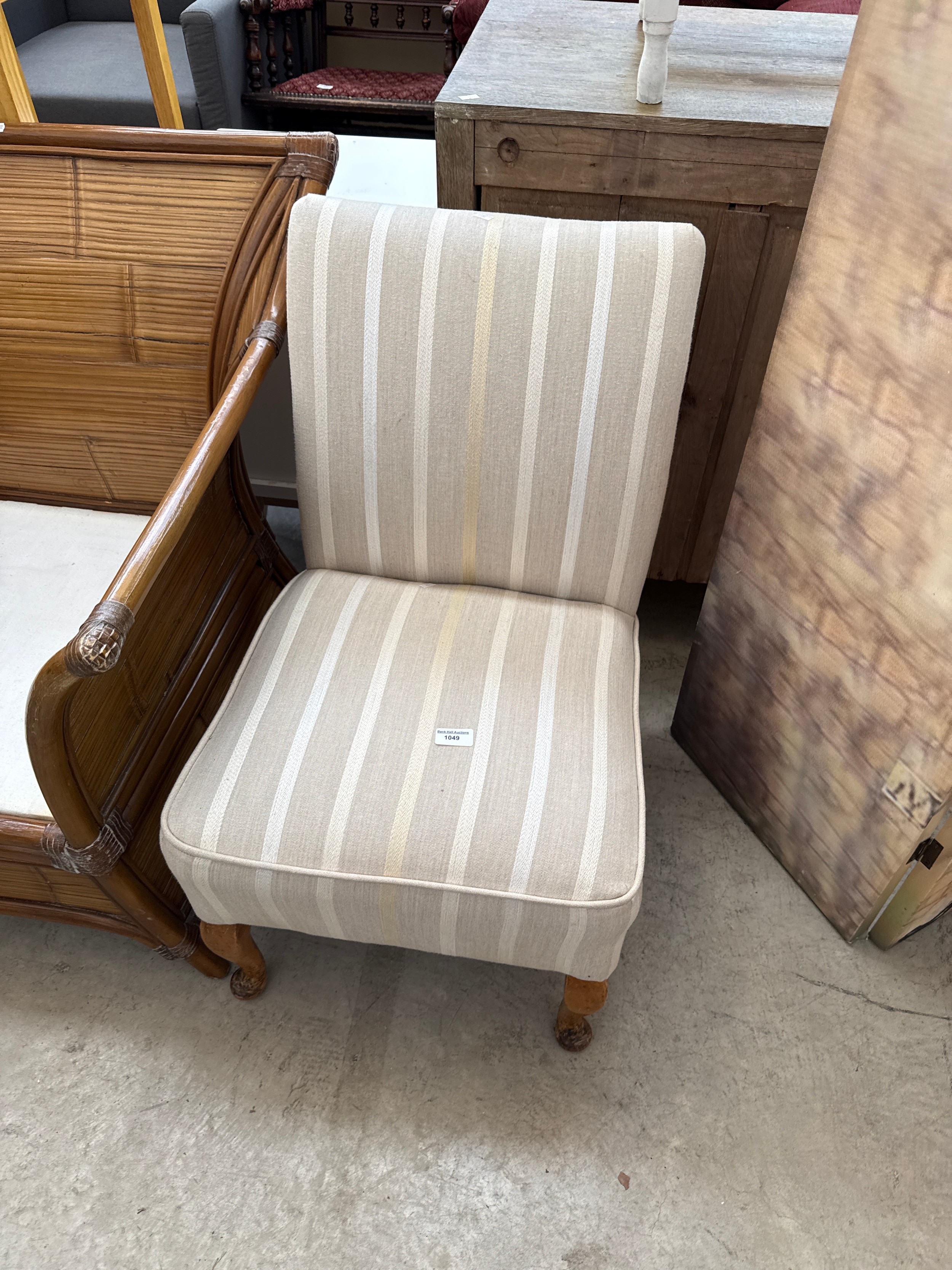 A small upholstered bedroom chair