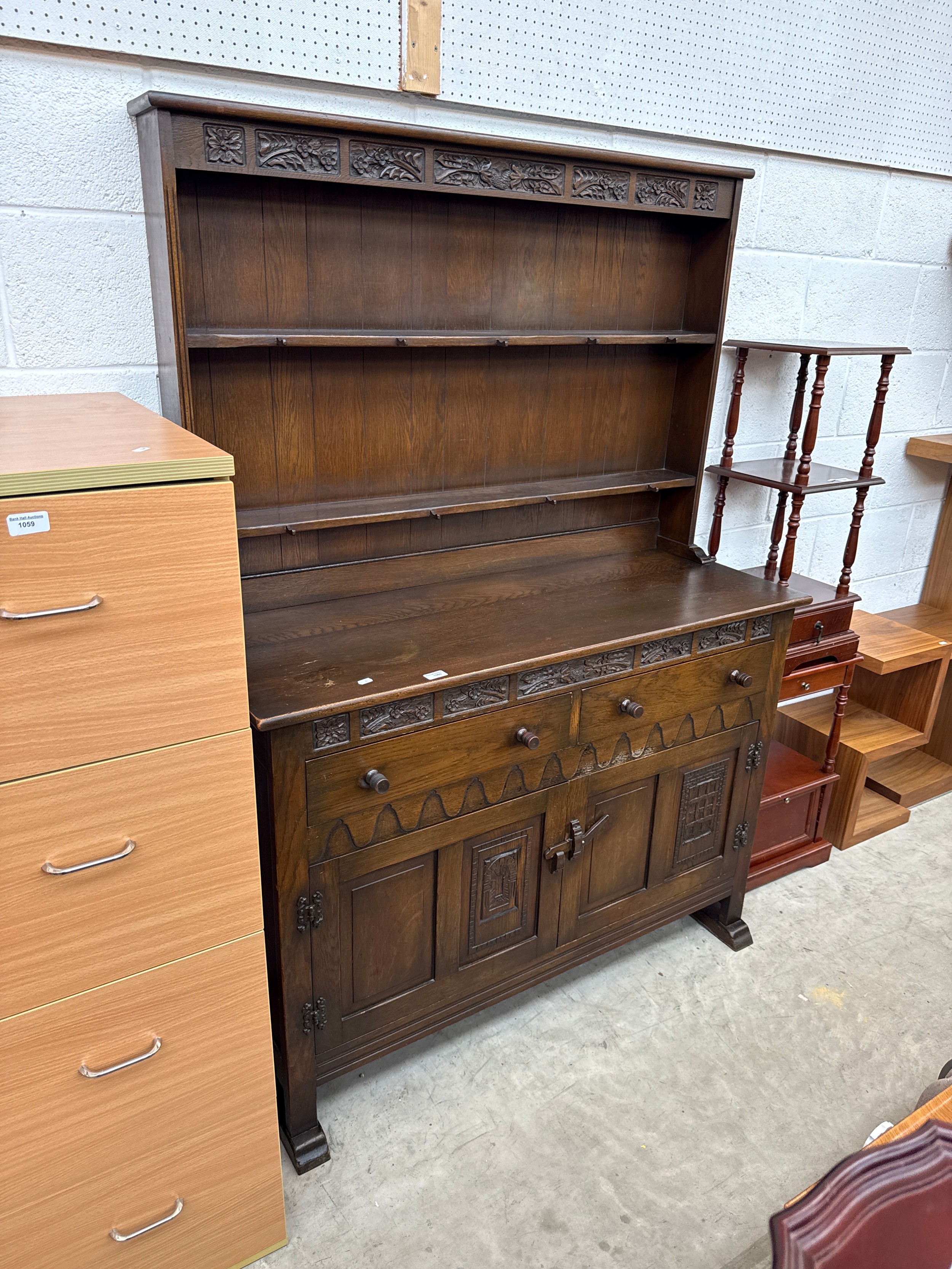 A large vintage carved oak 2 drawer Welsh dresser - one a/f door for refixing