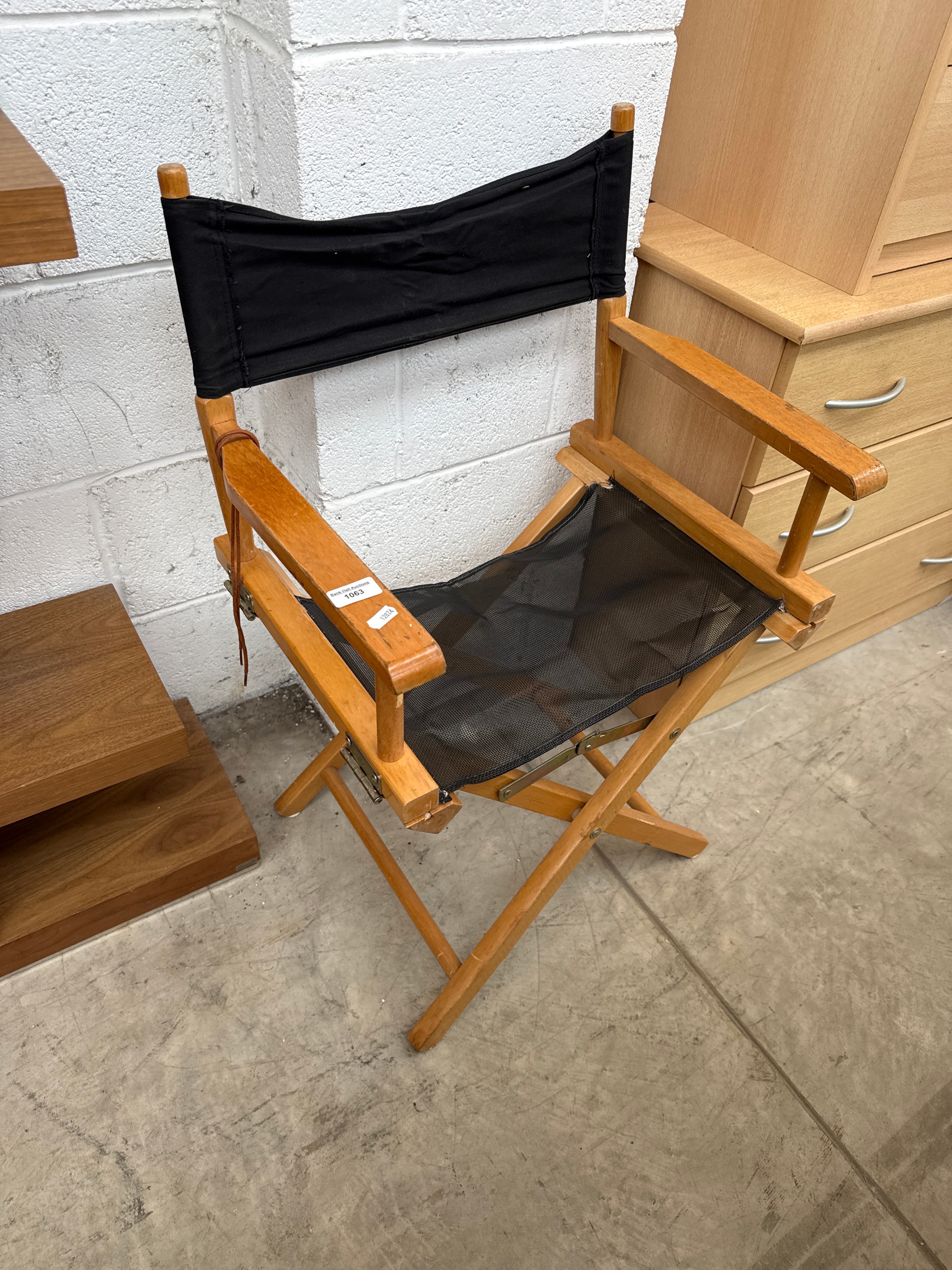 A vintage wood framed folding "director's" chair