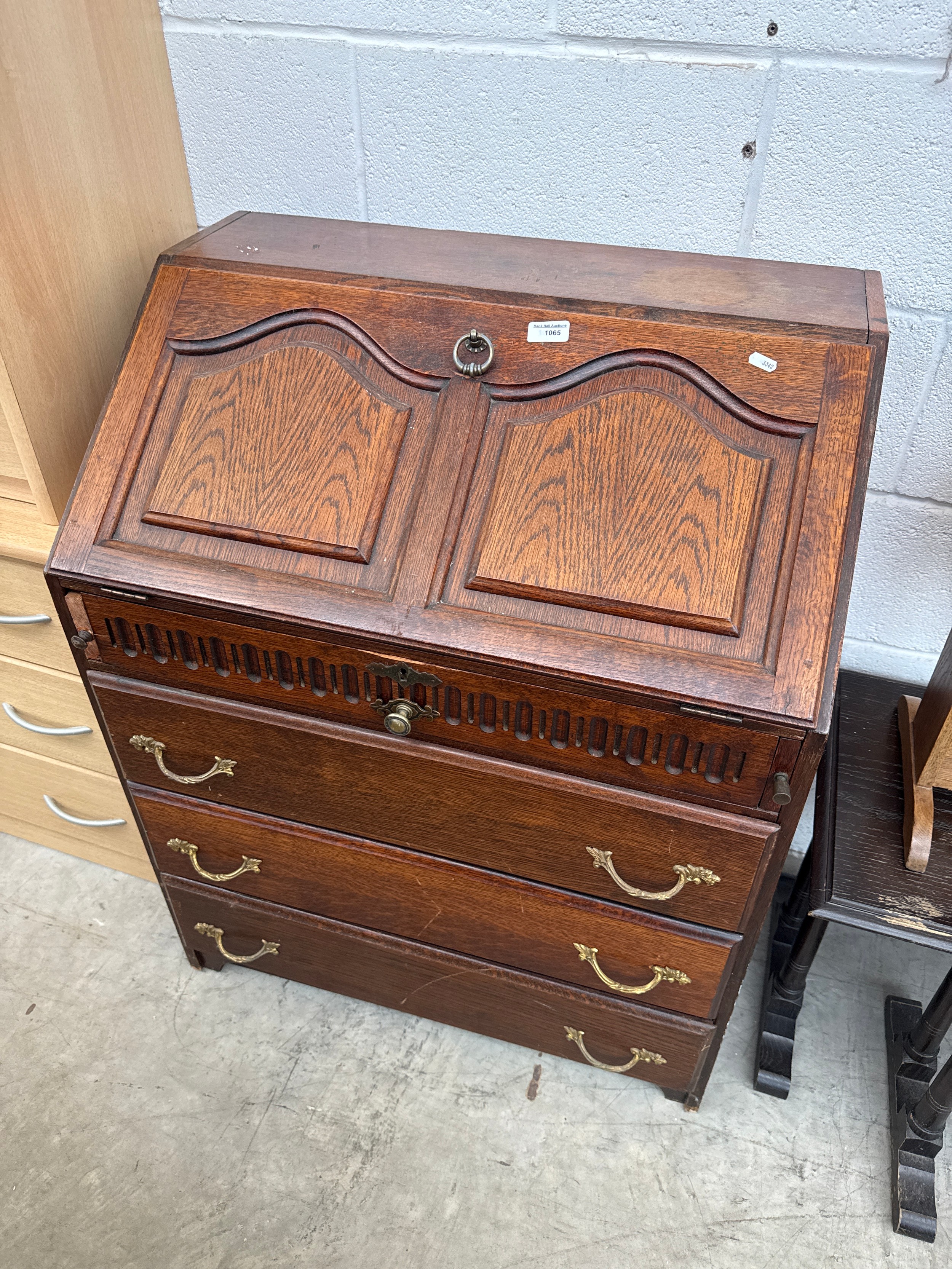 A vintage carved oak 4 drawer fall front bureau