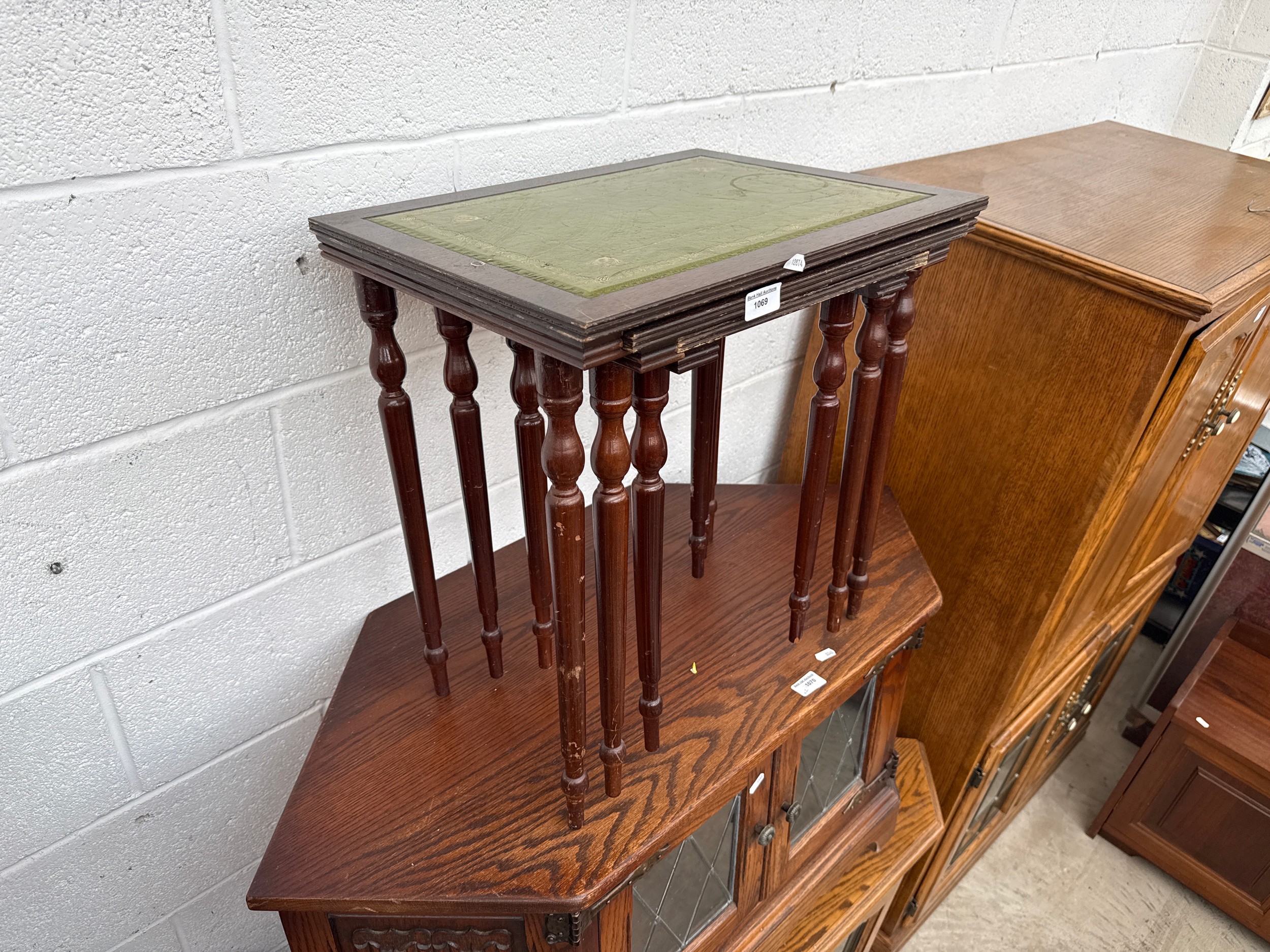 A nest of 3 x vintage leather topped occasional tables
