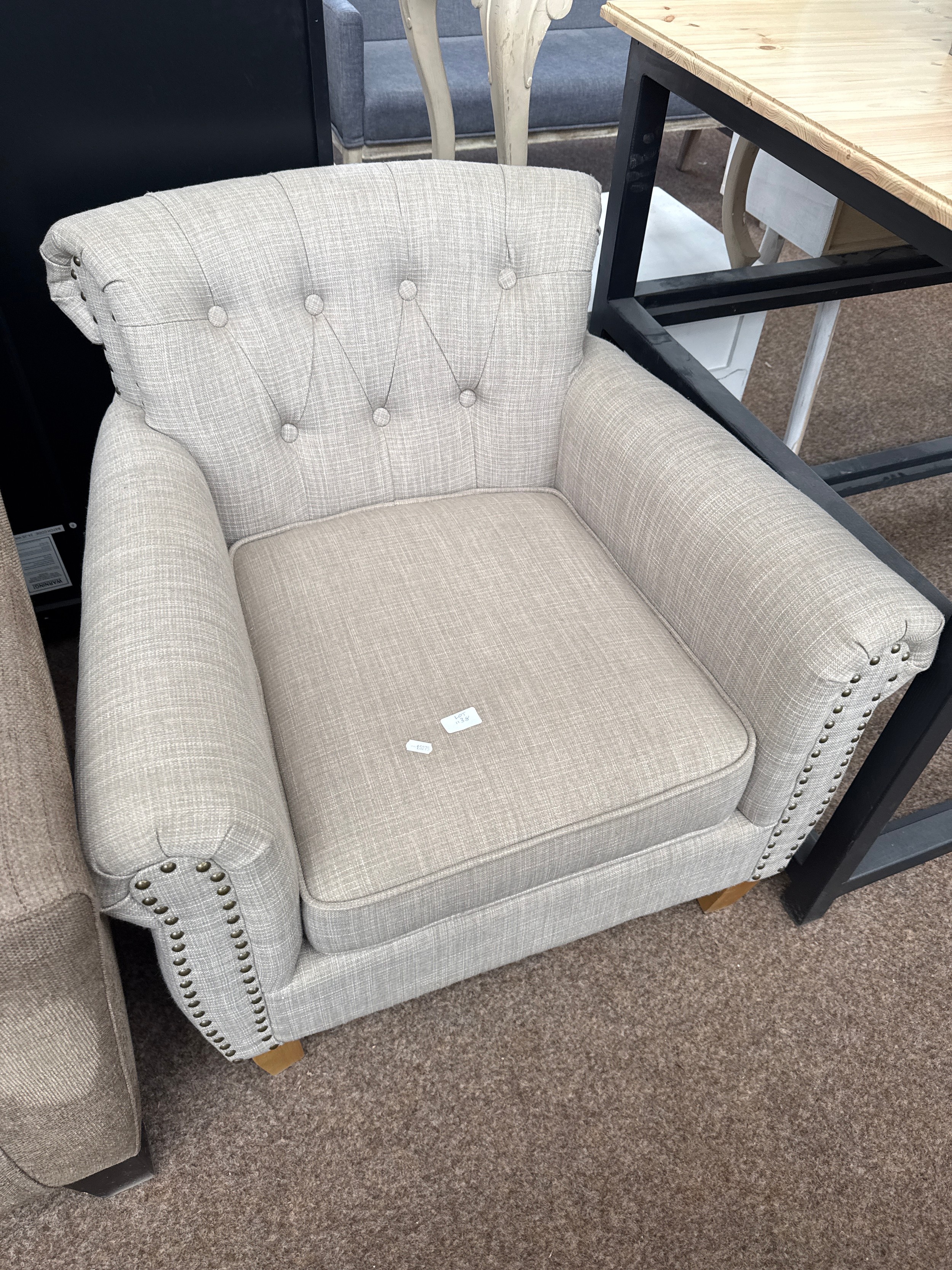 A small upholstered button backed armchair, as new, never used