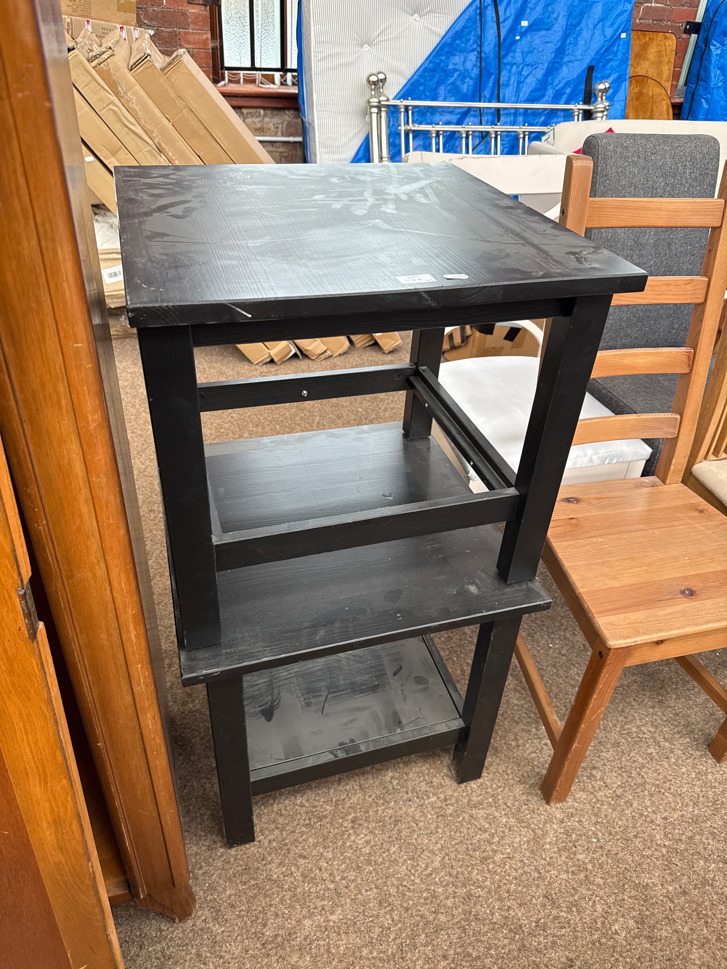A pair of small black wooden tables, both as new, never used (2)