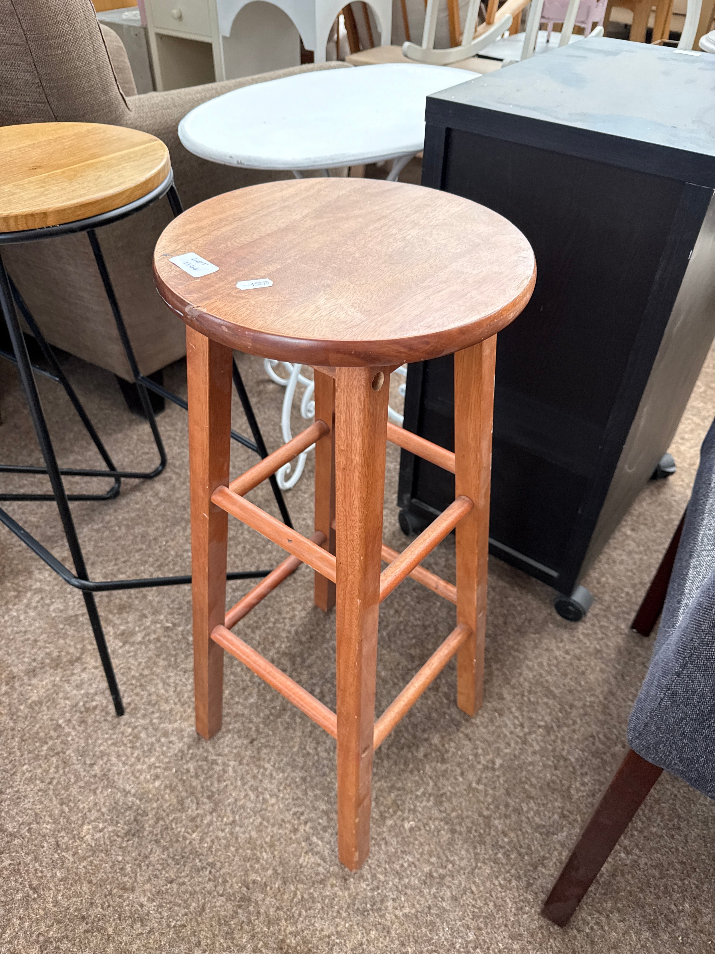 A tall wooden bar stool, as new, never used