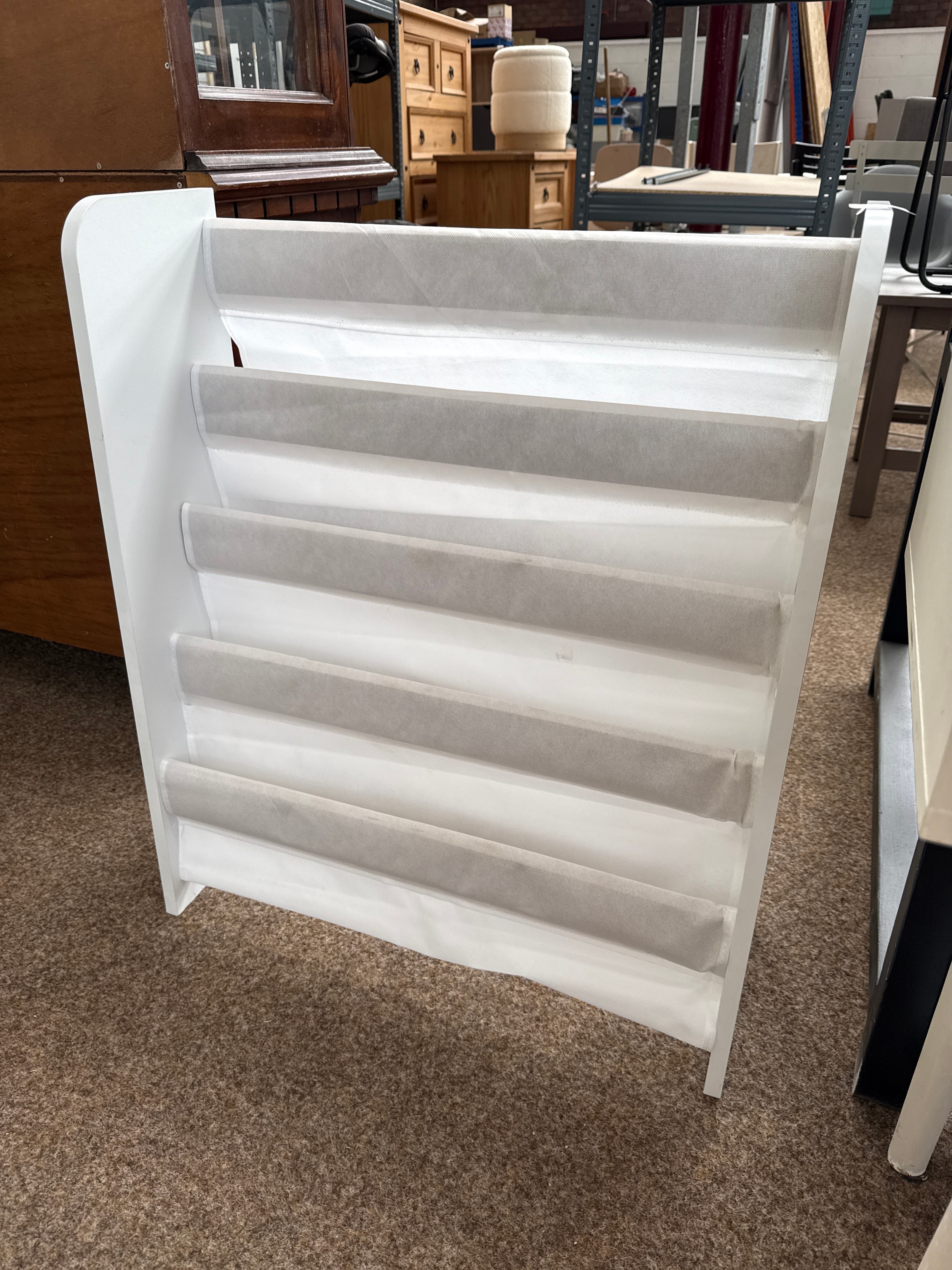 A 4 tier shoe rack, as new, never used