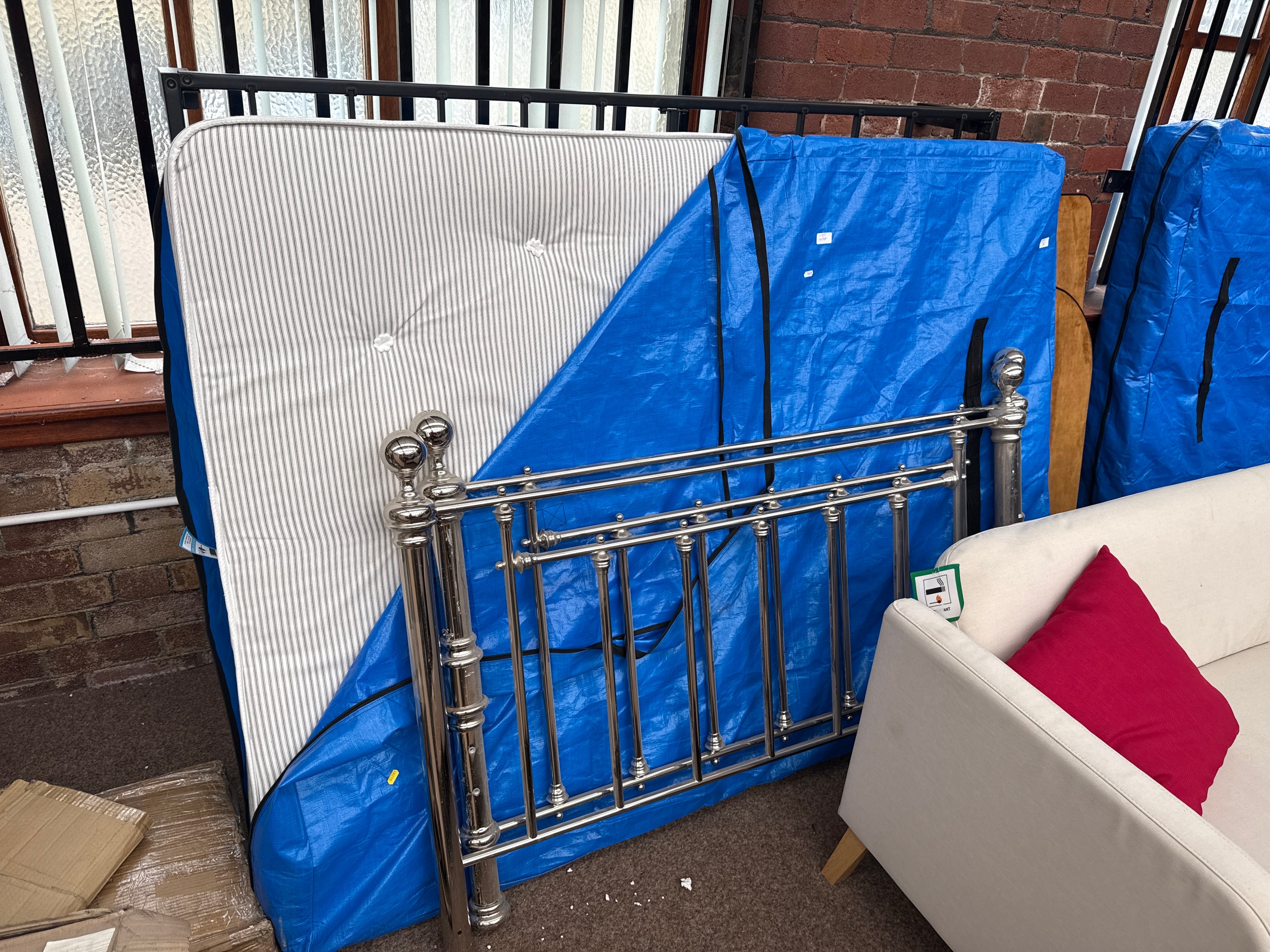 A metal double bed frame with chromed head/tail boards and mattress, as new