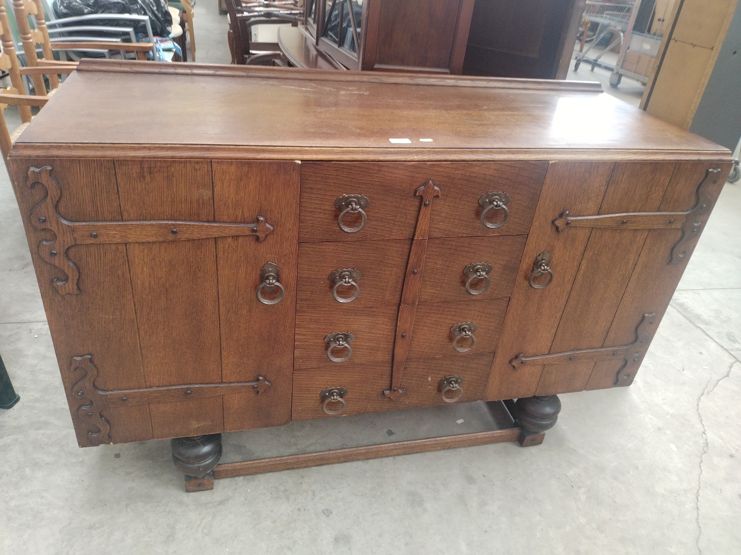 A vintage oak 4 drawer sideboard on bulbous legs