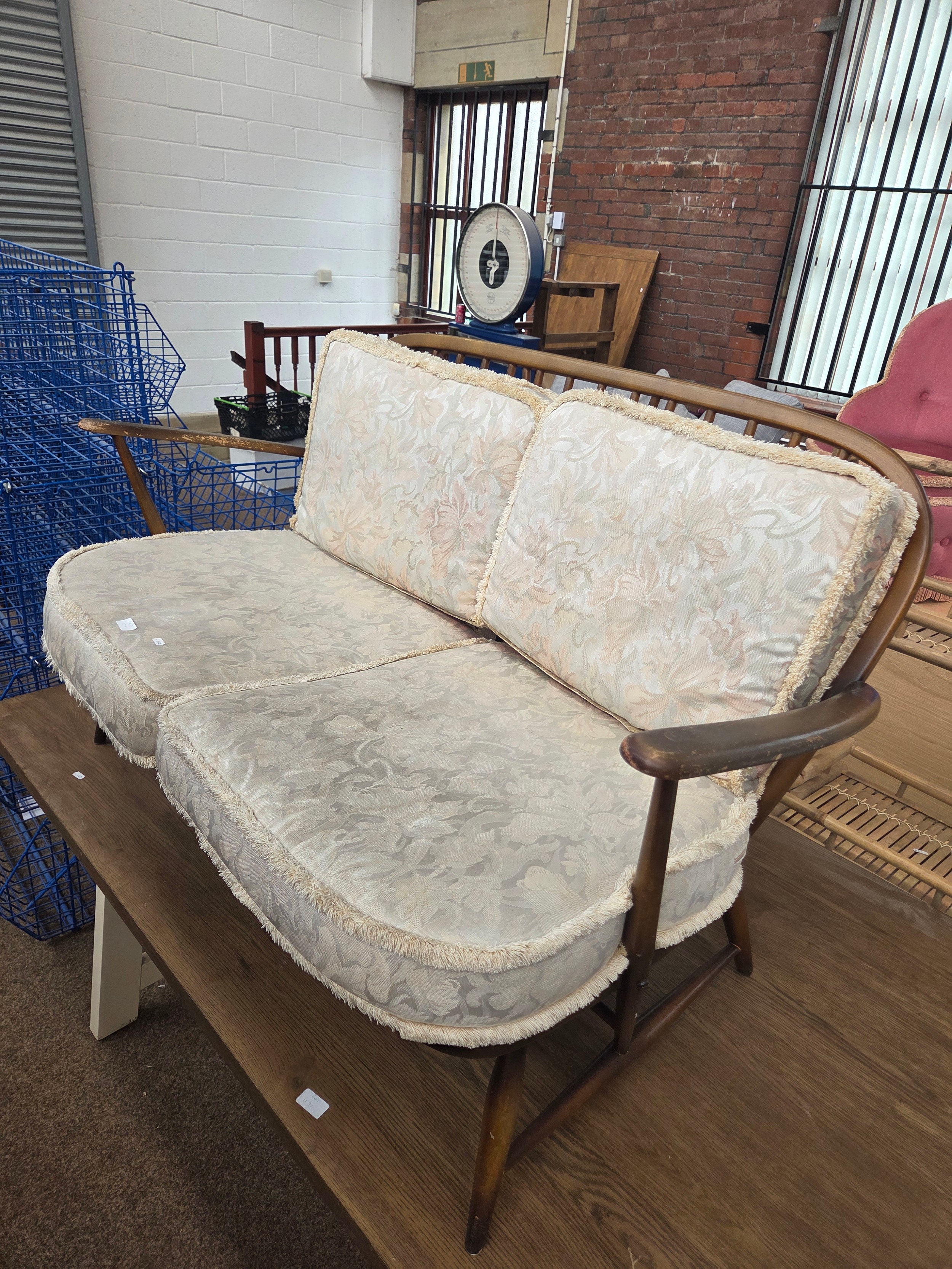 A vintage ERCOL spindle framed 2 seater sofa with cushions