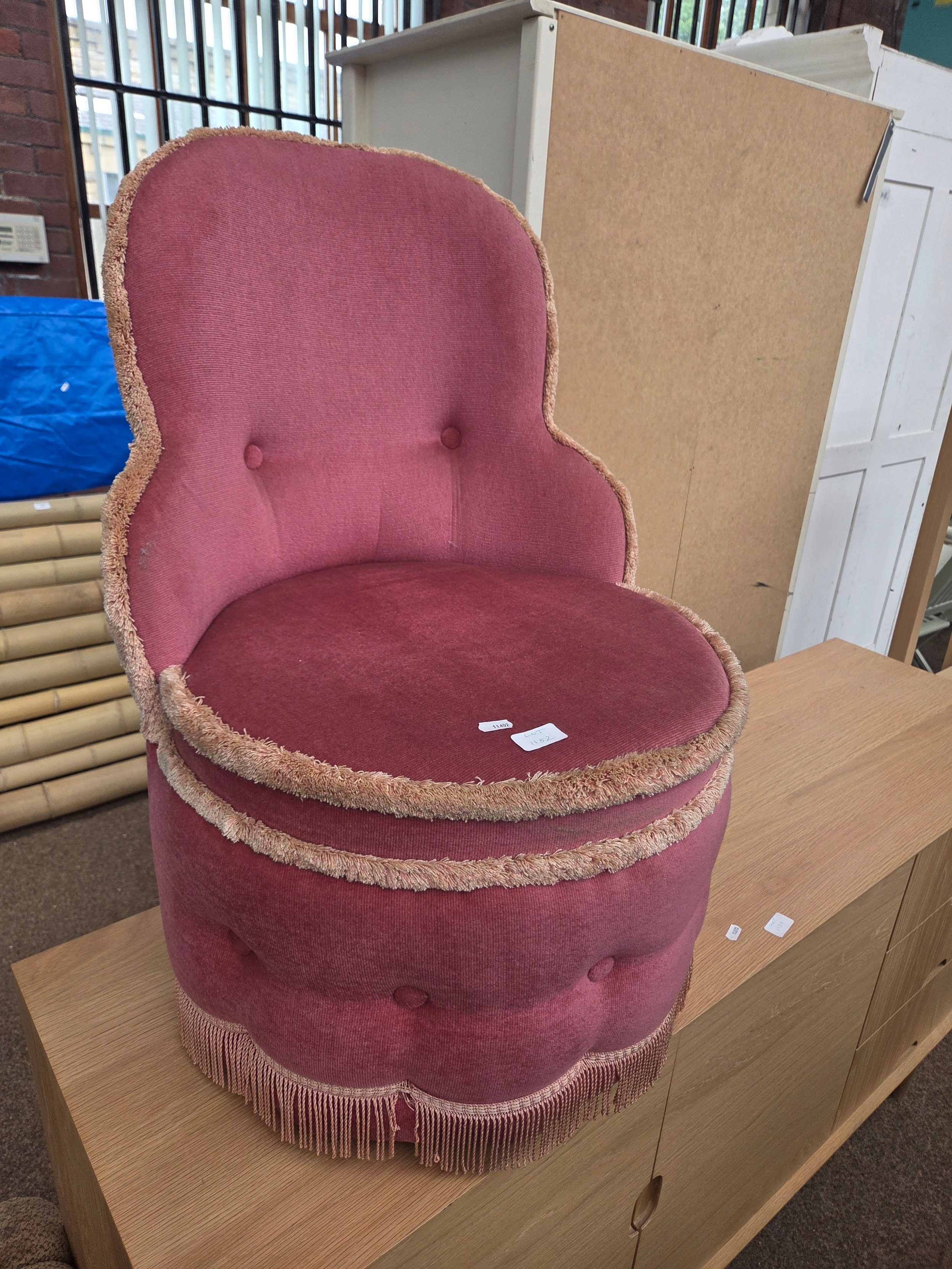 A small vintage upholstered bedroom chair