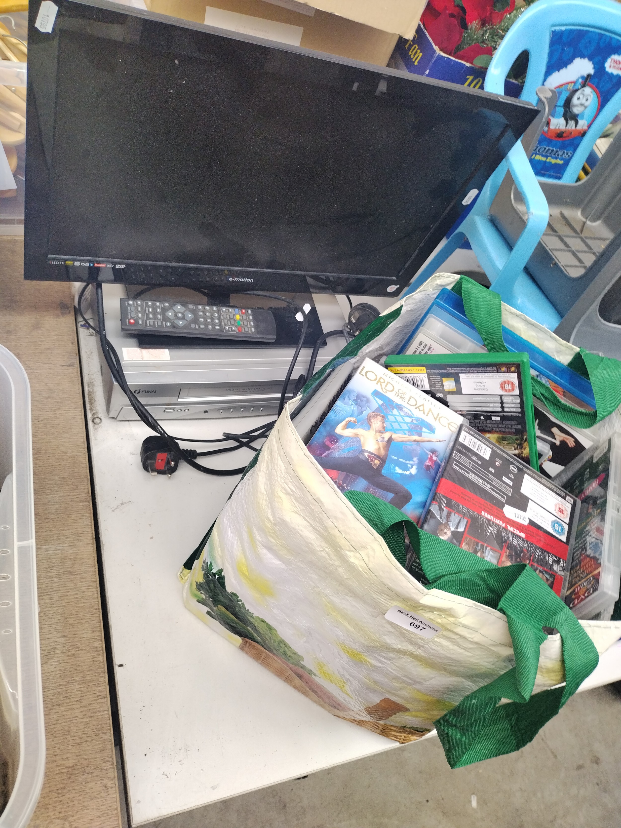 Emotion 21" TV, Funai VHS player and bag of DVDs